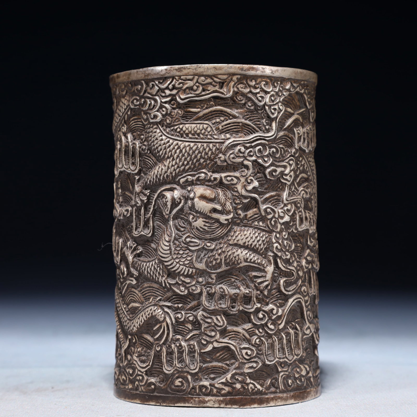 An Exquisite Silver-plated Bronze Seawater and Dragon Pattern Brush Pot: An Exquisite Silver-plated Bronze Seawater and Dragon Pattern Brush Pot,Ming Dynasty,China,Xuande Mark,Size:3.1inx4.7in,Weight:550g 铜镀银海水龙纹笔
