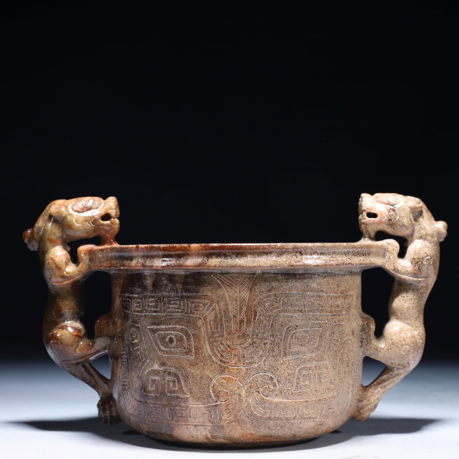 An Archaic Archaic Jade Beast-Face Pattern Double-Ears Jar: An Archaic Archaic Jade Beast-Face Pattern Double-Ears Jar,Ancient Time,China,Size:7.1inx4.9inx4.1in,Weight:1050g 高古玉兽面纹双耳罐,中Þ