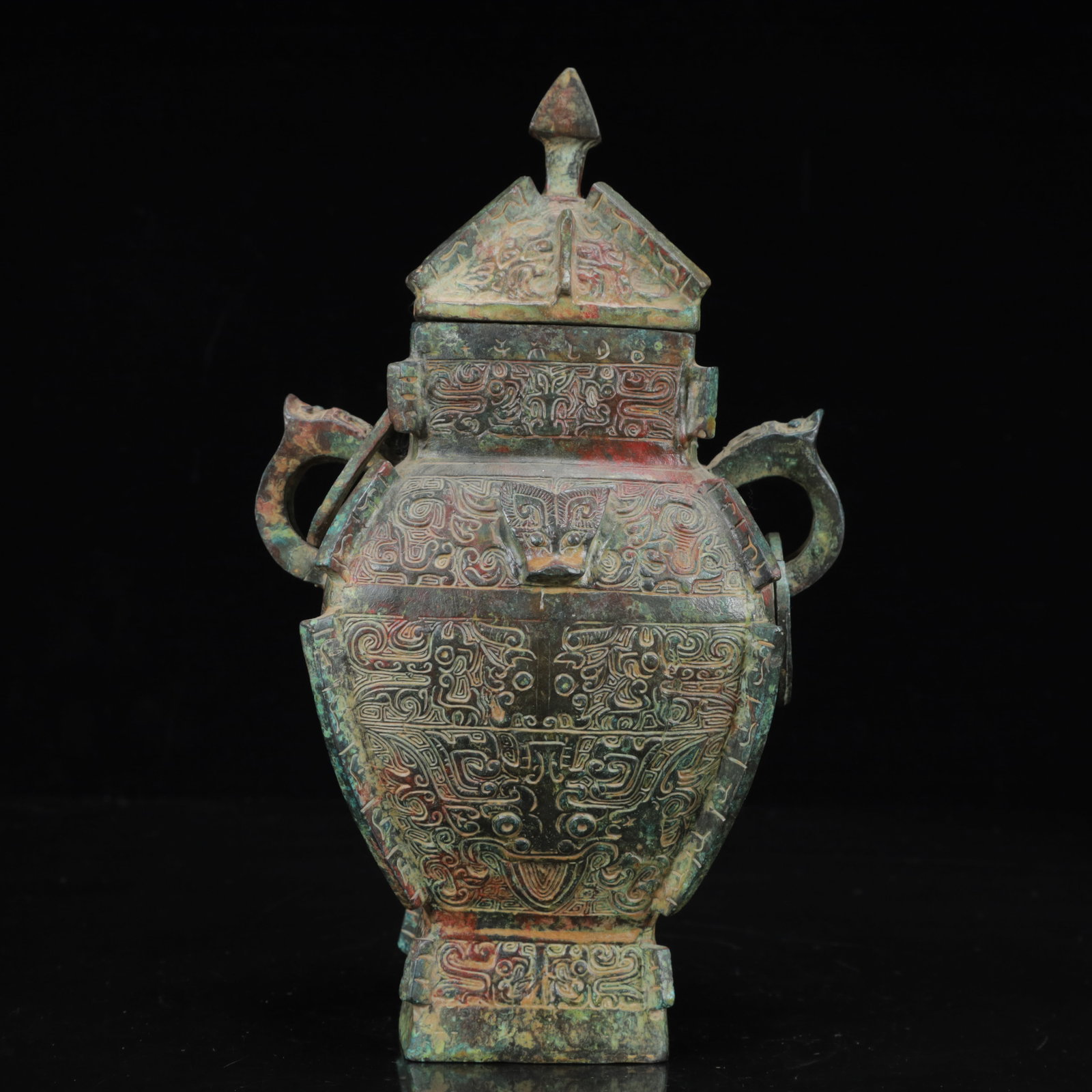 An Archaic Bronze Beast-Face Pattern Beast-Ears Vase: An Archaic Bronze Beast-Face Pattern Beast-Ears Vase,the Warring States Period in China,Size:6.3inx4.3inx9.8in,Weight:1800g 青铜兽面纹兽耳瓶,中