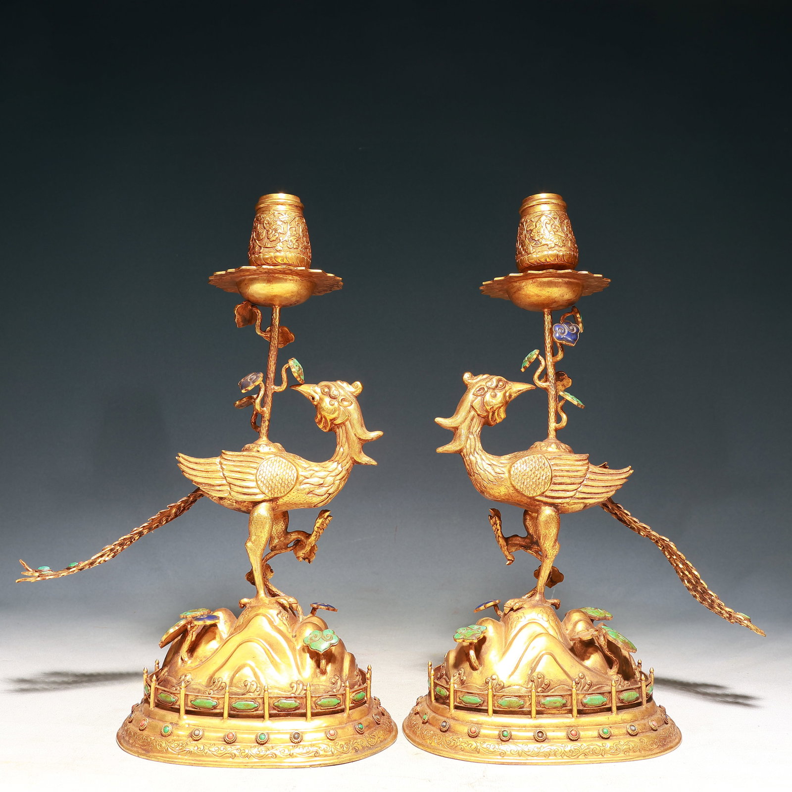 A Pair of Rare Gilt Bronze Ganoderma lucidum Pattern Peacock-Shaped Candlesticks,Inlaid Turquoise: A Pair of Rare Gilt Bronze Ganoderma lucidum Pattern Peacock-Shaped Candlesticks,Inlaid Turquoise,Qing Dynasty, China,Qianlong Four-character Mark,Size:10.2inx5.1inx14.2in,Weight:3000g 一对