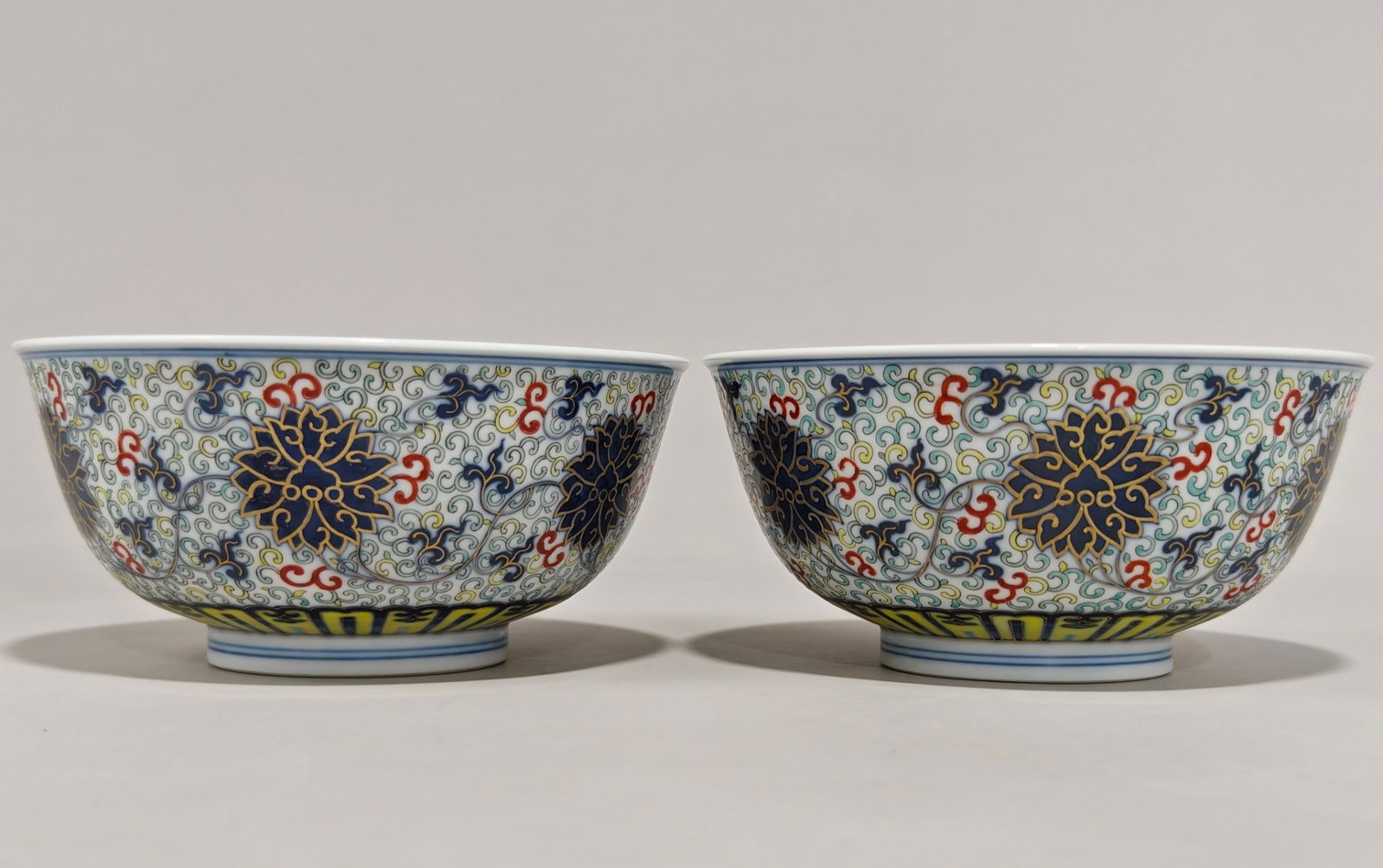 A Pair of Exquisite Doucai Painted Gold Lotus Pattern Bowls: A Pair of Exquisite Doucai Painted Gold Lotus Pattern Bowls,Qing Dynasty,China,Guangxu Six-character Mark,Size:3.1inx6.5in 一对斗彩描金缠枝莲ń