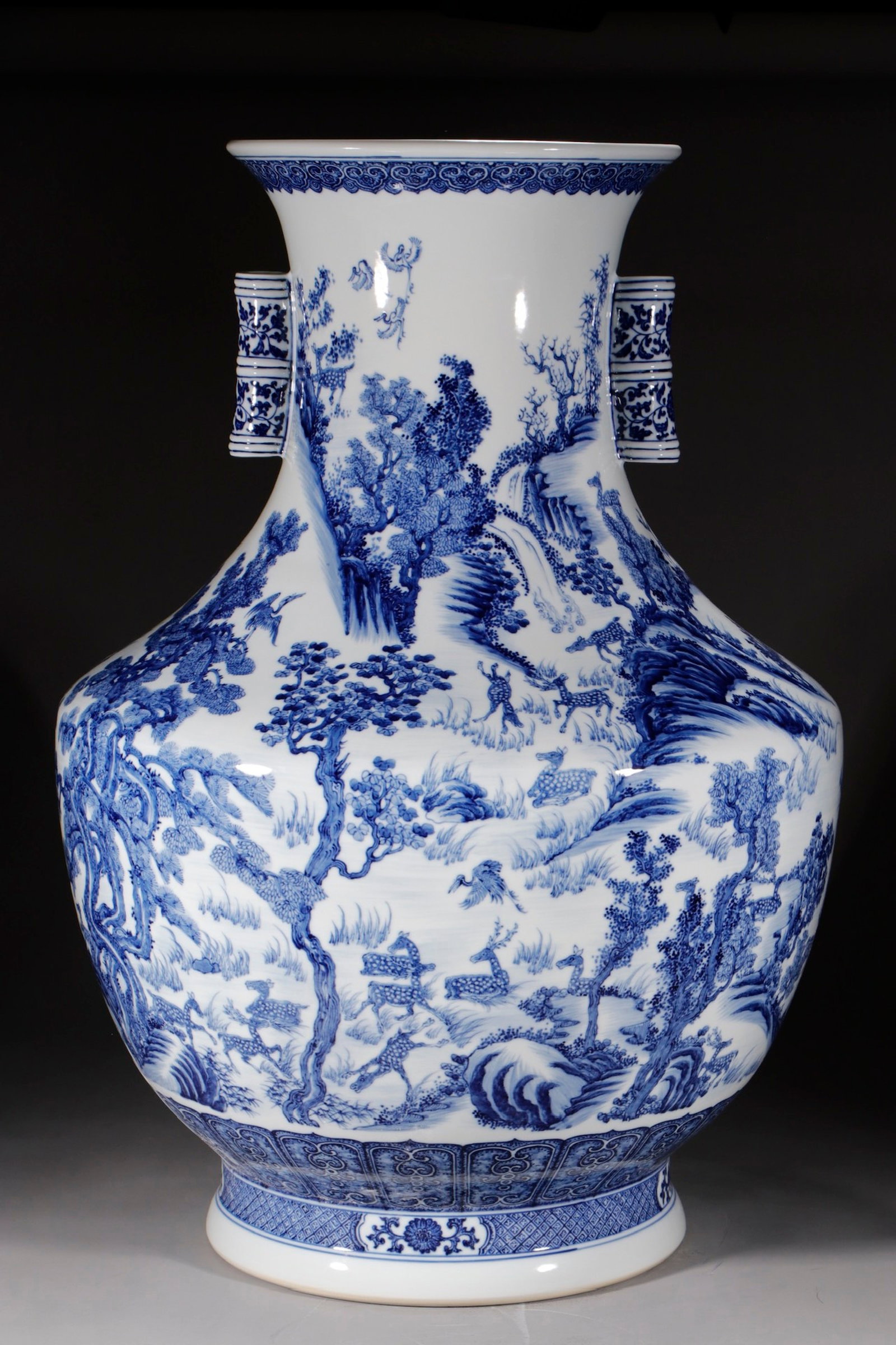 A Huge Yellow Ground Blue and White Landscape and Deer Pattern Double-Ears Vase: A Huge Yellow Ground Blue and White Landscape and Deer Pattern Double-Ears Vase,Qing Dynasty,China,Qianlong Six-character Mark,Size:30.3in 黄地青花山水鹿ń