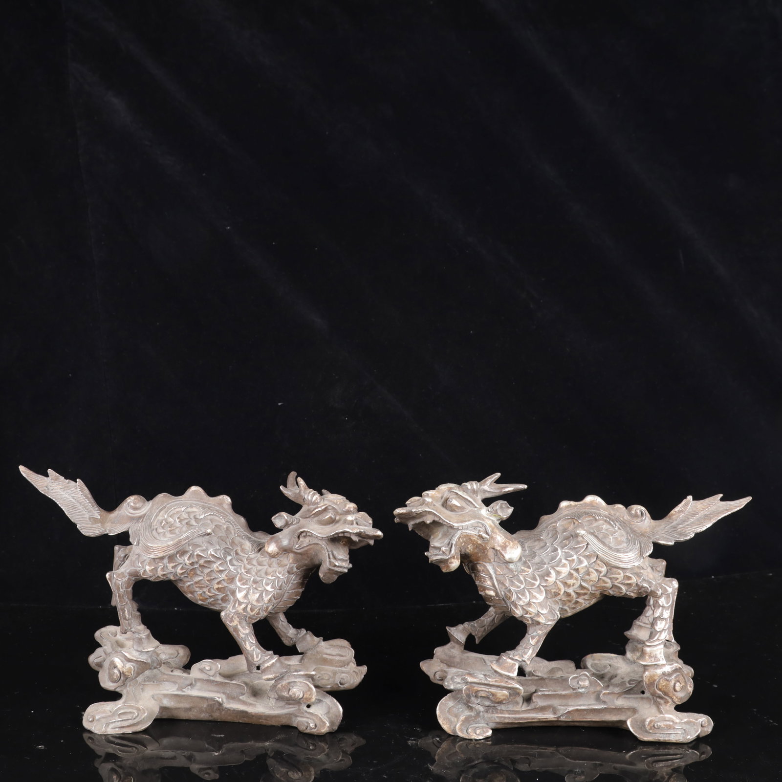 A Pair of Exquisite Silver-Plated Bronze Kylin Ornaments: A Pair of Exquisite Silver-Plated Bronze Kylin Ornaments,Qing Dynasty,China,Size:9.8inx2.8inx6.7in,Weight:3800g 一对铜镀银麒麟摆件,中国