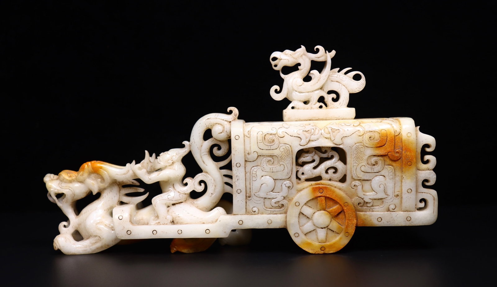 A Rare White Jade Auspicious Beast Pattern Car Ornament: A Rare White Jade Auspicious Beast Pattern Car Ornament,Qing Dynasty, China,Size:14.2inx3.1inx7.2in,Weight:2945g 白玉瑞兽纹车摆件,中国଀