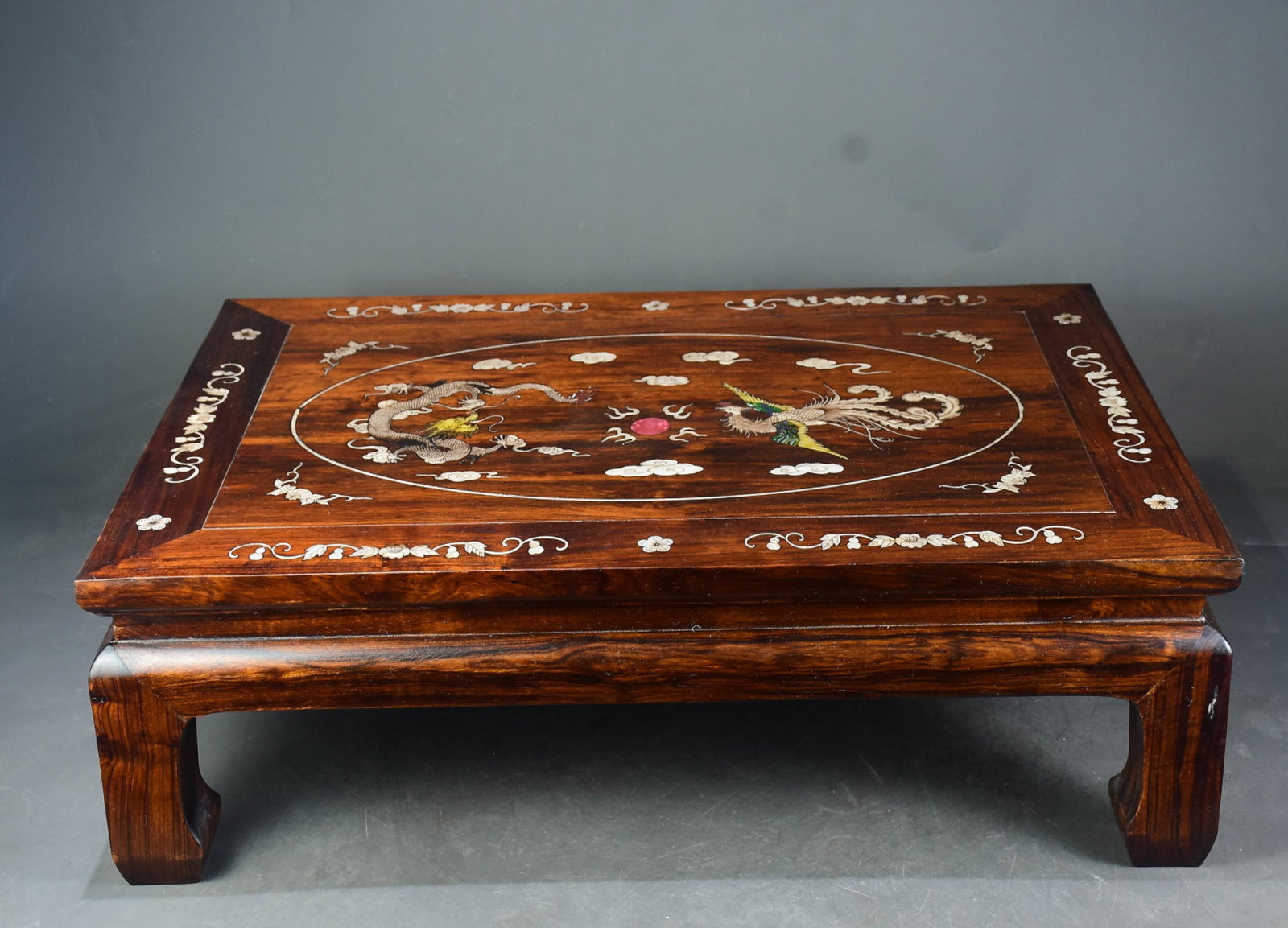 A Rare Huanghuali wood Inlaid Shell Dragon and Phoenix Pattern Table: A Rare Huanghuali wood Inlaid Shell Dragon and Phoenix Pattern Table,Qing Dynasty,China,Size:8.3inx25.2inx17.3in 黄花梨木镶贝壳龙凤纹桌