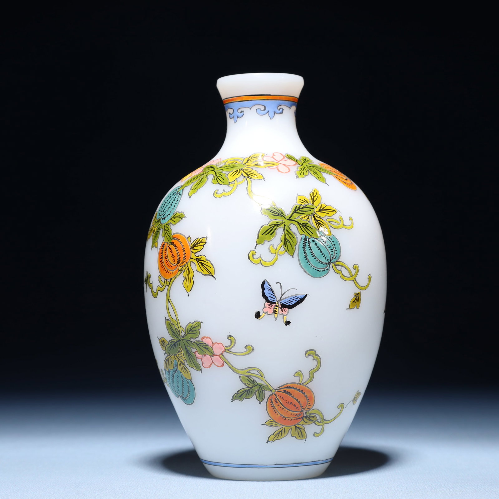 An Exquisite Glass Flower and Butterfly Pattern Vase: An Exquisite Glass Flower and Butterfly Pattern Vase,Qing Dynasty,China,Qianlong Four-character Mark,Size:3.5inx6.7in,Weight:311g 琉璃花卉蝴蝶纹瓶,È