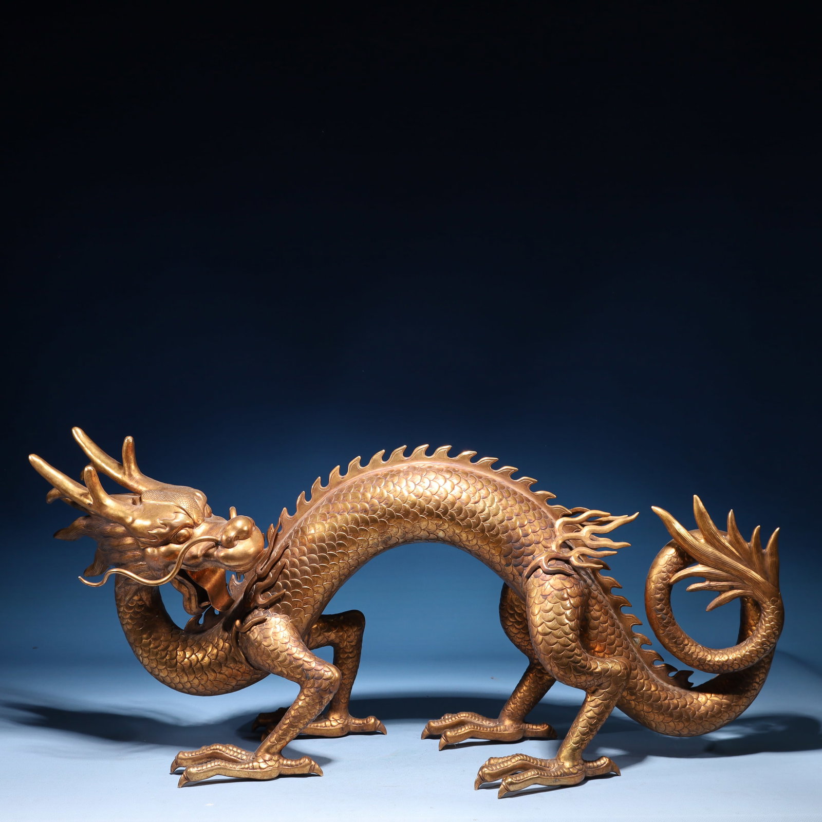 An Exquisite Gilt Bronze Dragon Ornament: An Exquisite Gilt Bronze Dragon Ornament,Qing Dynasty,China,Size:28.3inx8.3inx13in,Weight:15500g 铜鎏金龙摆件,中国清代
