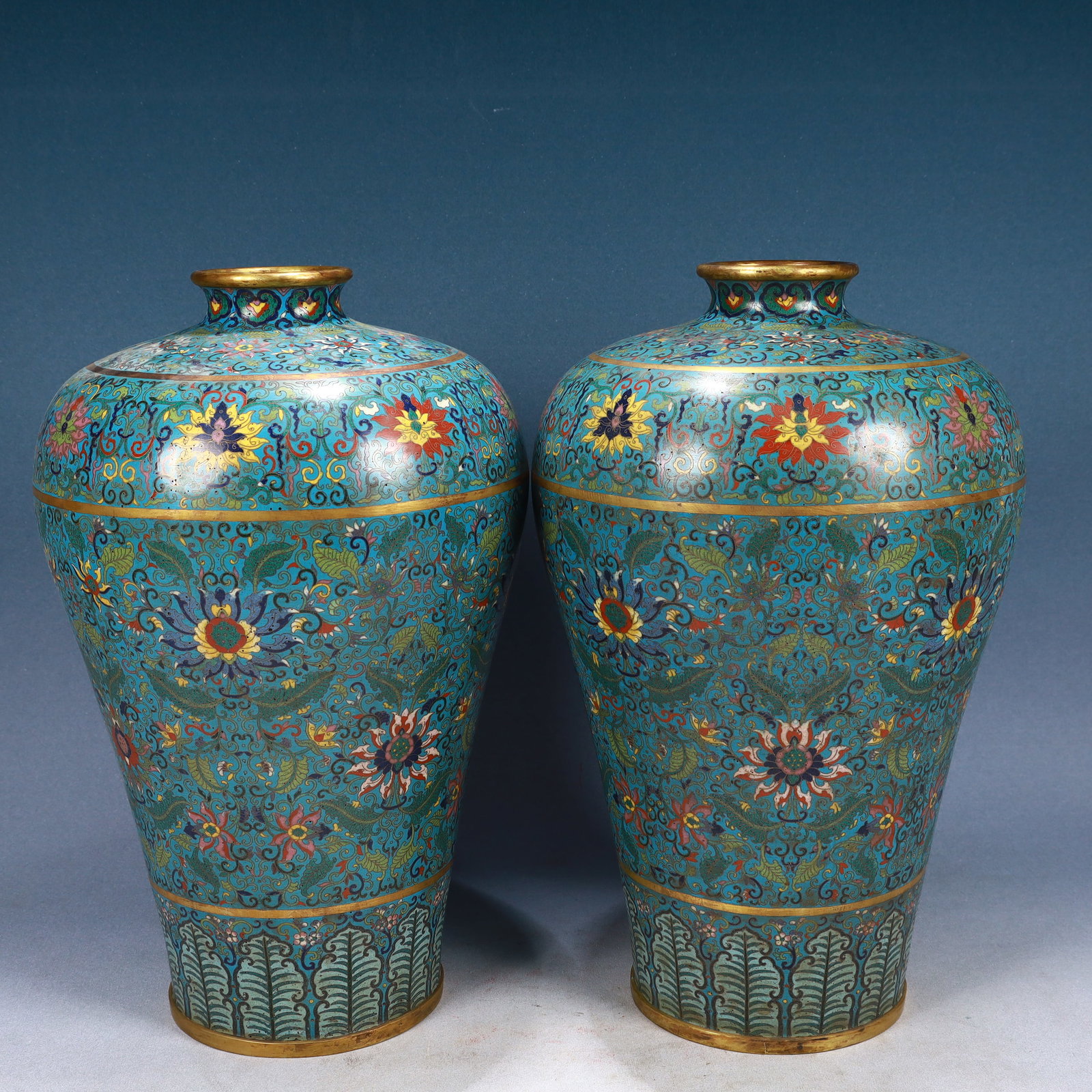 A Pair of Huge Cloisonne Lotus Pattern Vases: A Pair of Huge Cloisonne Lotus Pattern Vases,Qing Dynasty, China,Qianlong Four-character Mark,Size:9.4inx16.1in,Weight:9450g 一对景泰蓝缠枝莲纹