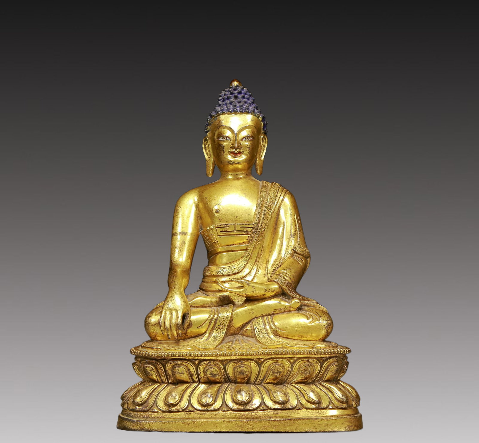 A Solemn Gilt Bronze Statue of Sakyamuni: A Solemn Gilt Bronze Statue of Sakyamuni,Ming Dynasty, China,Size:6.3inx4.1inx9.4in,Weight:2185g 铜鎏金释迦摩尼像，明代