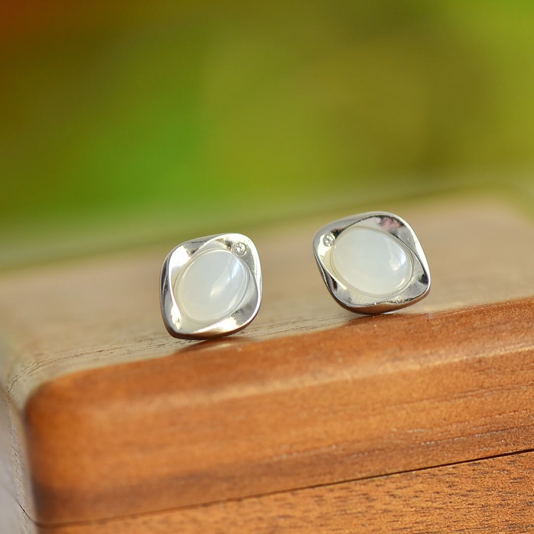 A Pair of Exquisite Sterling Silver Inlaid White Jade Earrings: A Pair of Exquisite Sterling Silver Inlaid White Jade Earrings,Size:0.2inx0.3in 一对纯银镶白玉耳钉