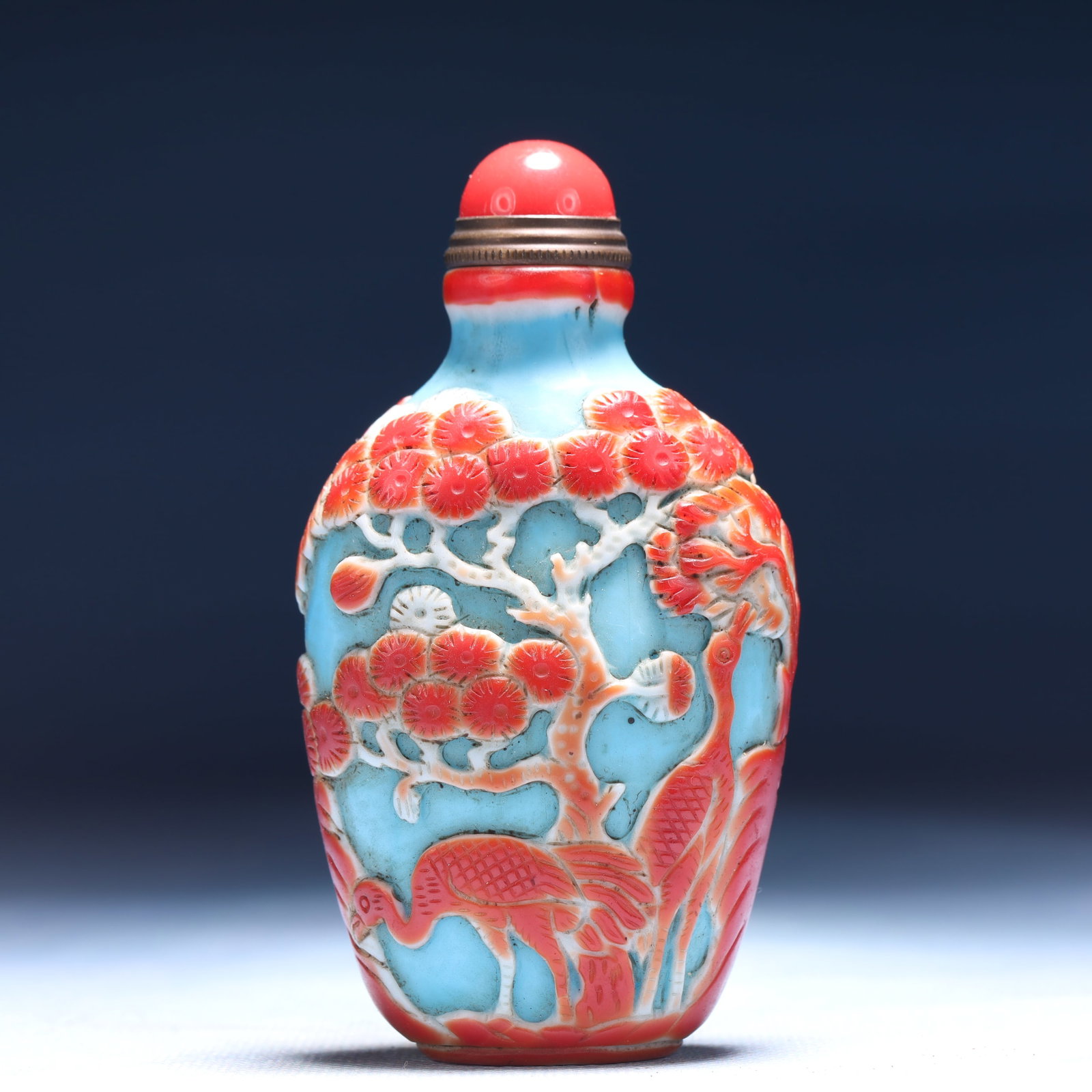 An Exquisite Glass Pine and Crane Pattern Snuff Bottle: An Exquisite Glass Pine and Crane Pattern Snuff Bottle,Qing Dynasty,China,Daoguang Four-character Mark,Size:2inx1.2inx3.5in,Weight:109g 琉璃松鹤纹鼻烟壶