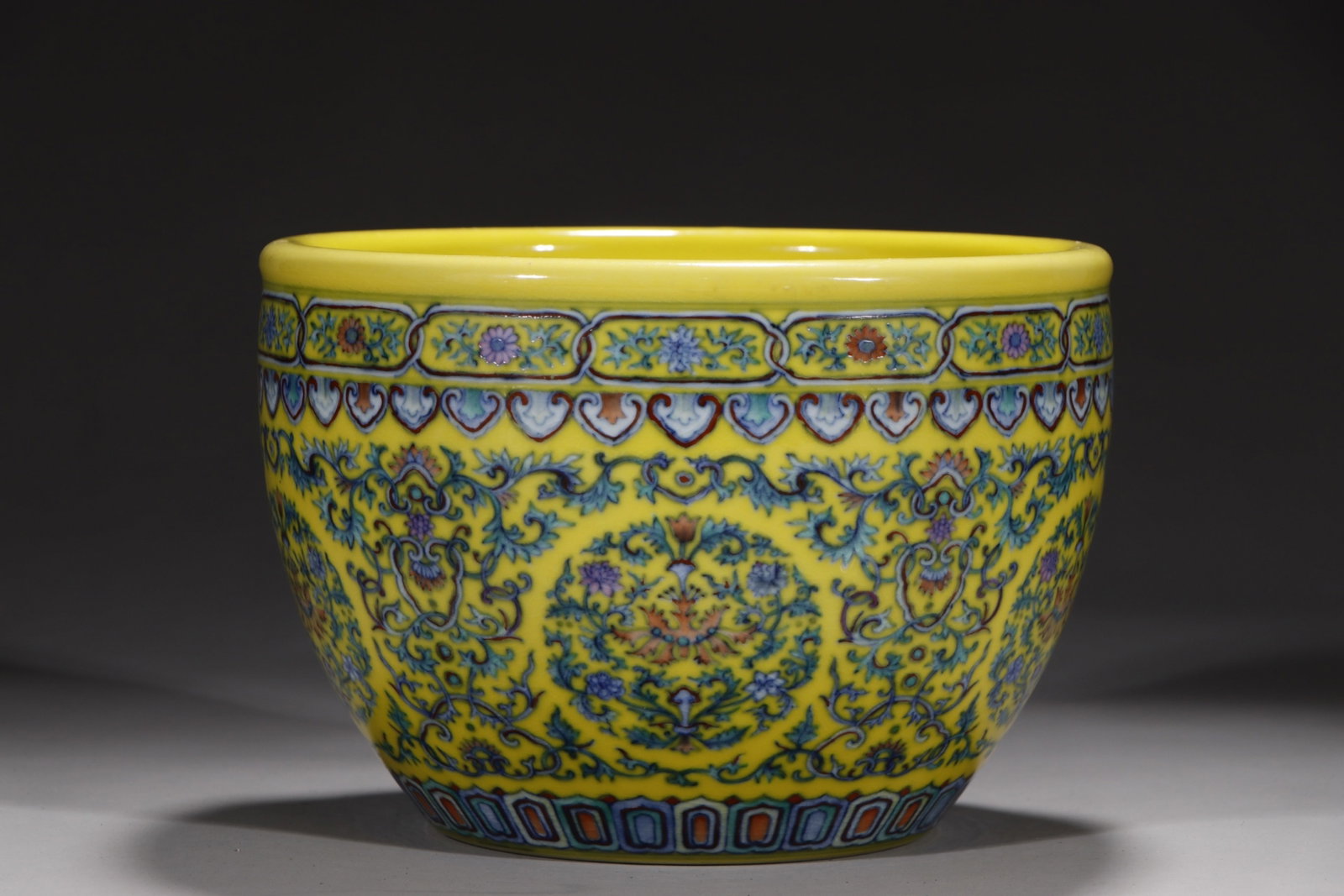 An Exquisite Yellow Ground Doucai Lotus Pattern Vat: An Exquisite Yellow Ground Doucai Lotus Pattern Vat,Qing Dynasty,China,Yongzheng Six-character Mark,Size:6.1inx8.7in 黄地斗彩缠枝莲纹缸中