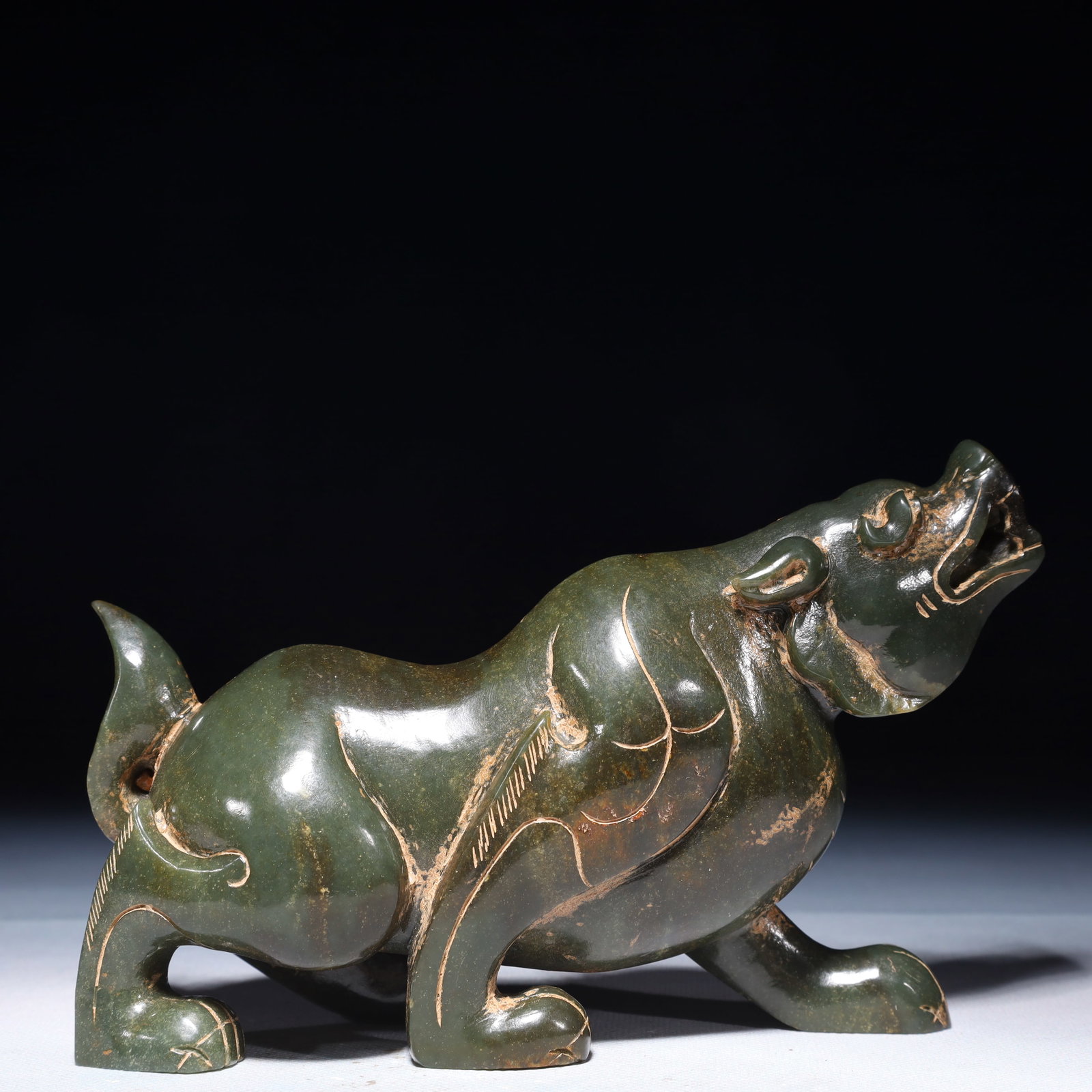 An Exquisite Jasper Beast Ornament: An Exquisite Jasper Beast Ornament,Qing Dynasty,China,Size:7.1inx2.4inx4.7in,Weight:1150g 碧玉兽摆件,中国清代