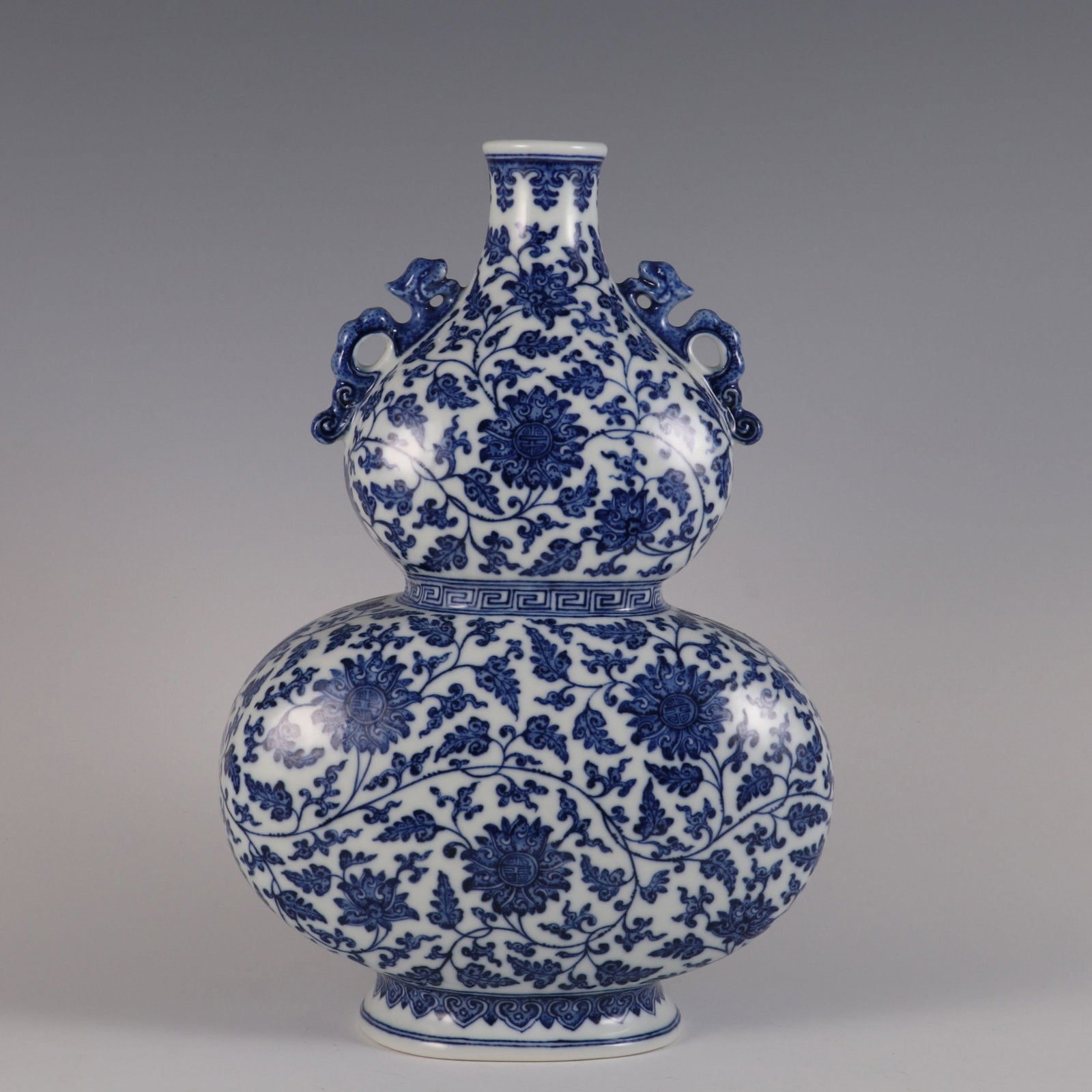 A Rare Blue and White Lotus Pattern Double-Ears Gourd-Shaped Vase: A Rare Blue and White Lotus Pattern Double-Ears Gourd-Shaped Vase,Qing Dynasty,China,Qianlong Six-character Mark,Size:13.3inx9.1in