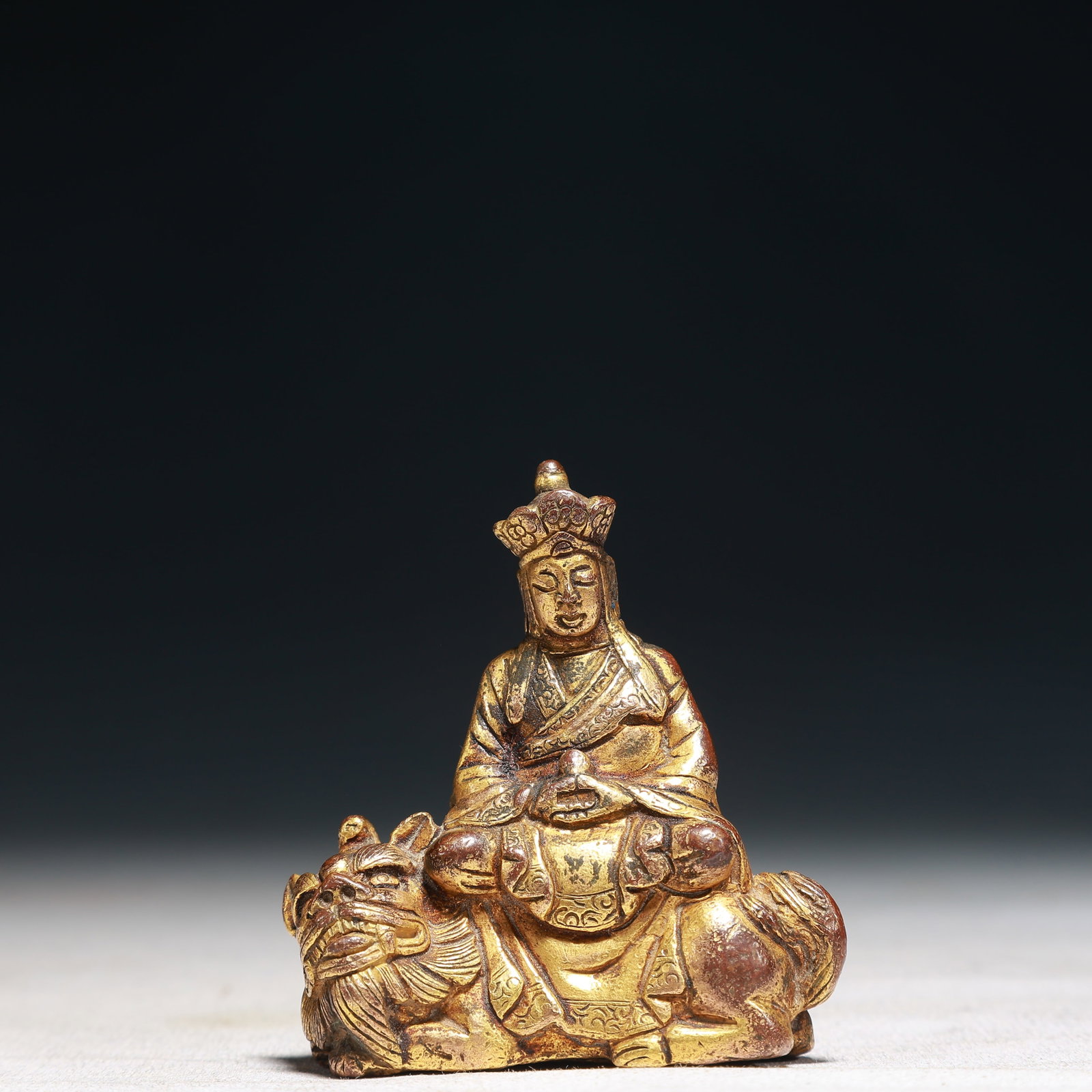 A Solemn Gilt Bronze Statue of Manjusri Rides the Lion: A Solemn Gilt Bronze Statue of Manjusri Rides the Lion,Qing Dynasty,China,Size:2.4inx0.8inx2.6in,Weight:150g 铜鎏金骑狮文殊菩萨像,中&#