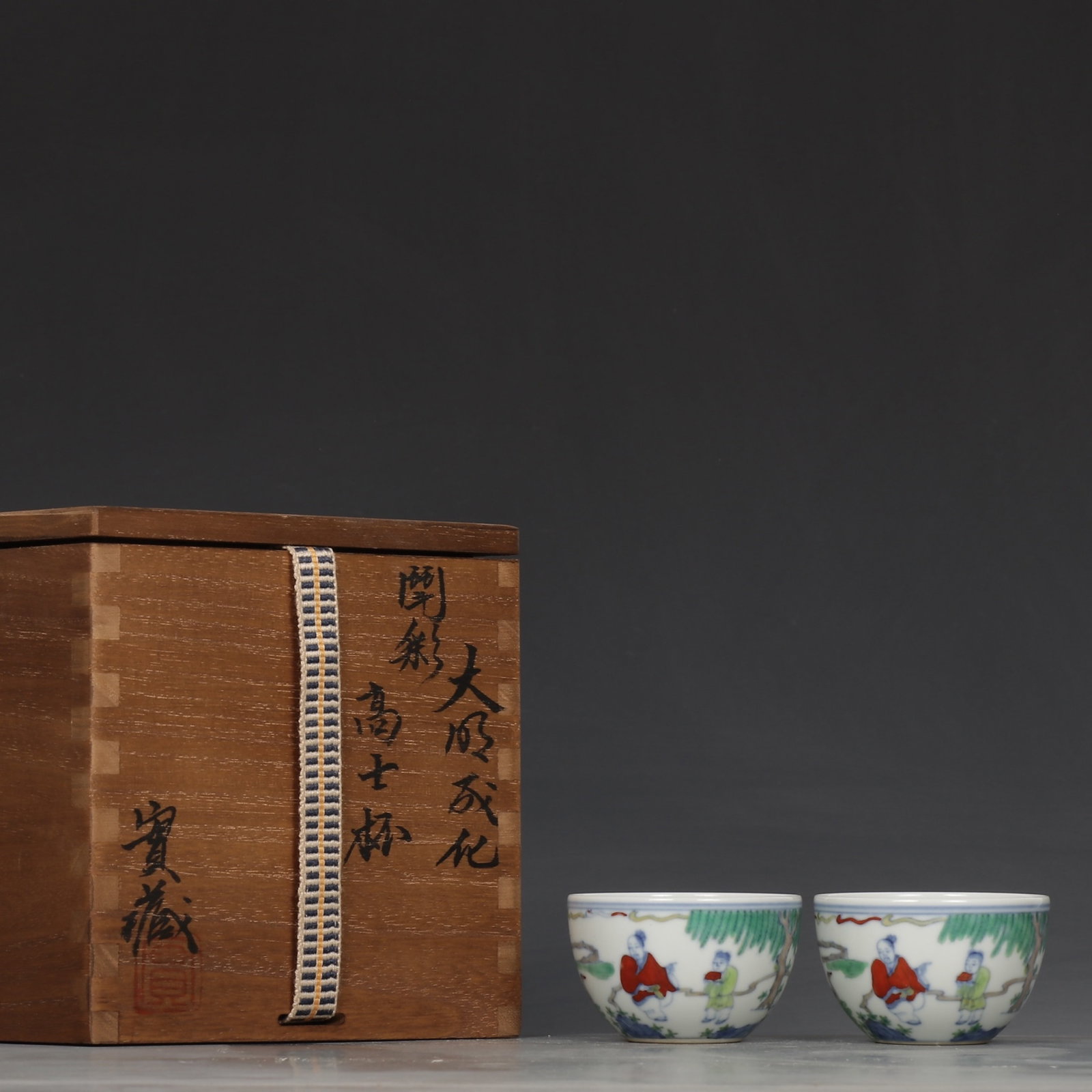 A Pair of Exquisite Doucai Character and Story Pattern Cups (1 of 9)