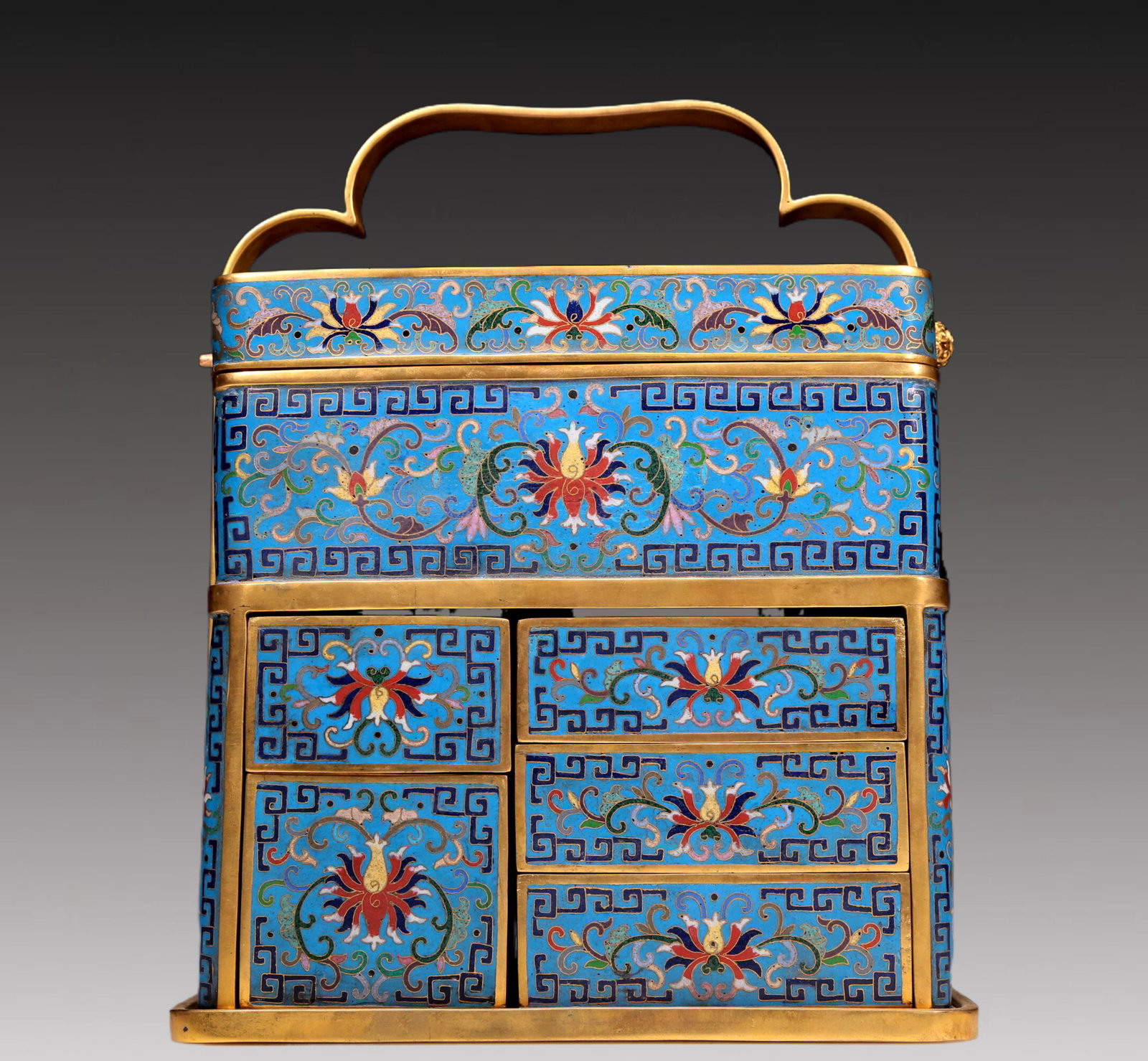 An Exquisite Cloisonne 'Figure& Scrolling Lotus' Box With An Overhead Handle: An Exquisite Cloisonne 'Figure& Scrolling Lotus' Box With An Overhead Handle. Enamaled with polychrome patterns, all reserved on a bright turquoise ground. Chinese Qing Dynasty. Qianlong Six-Character