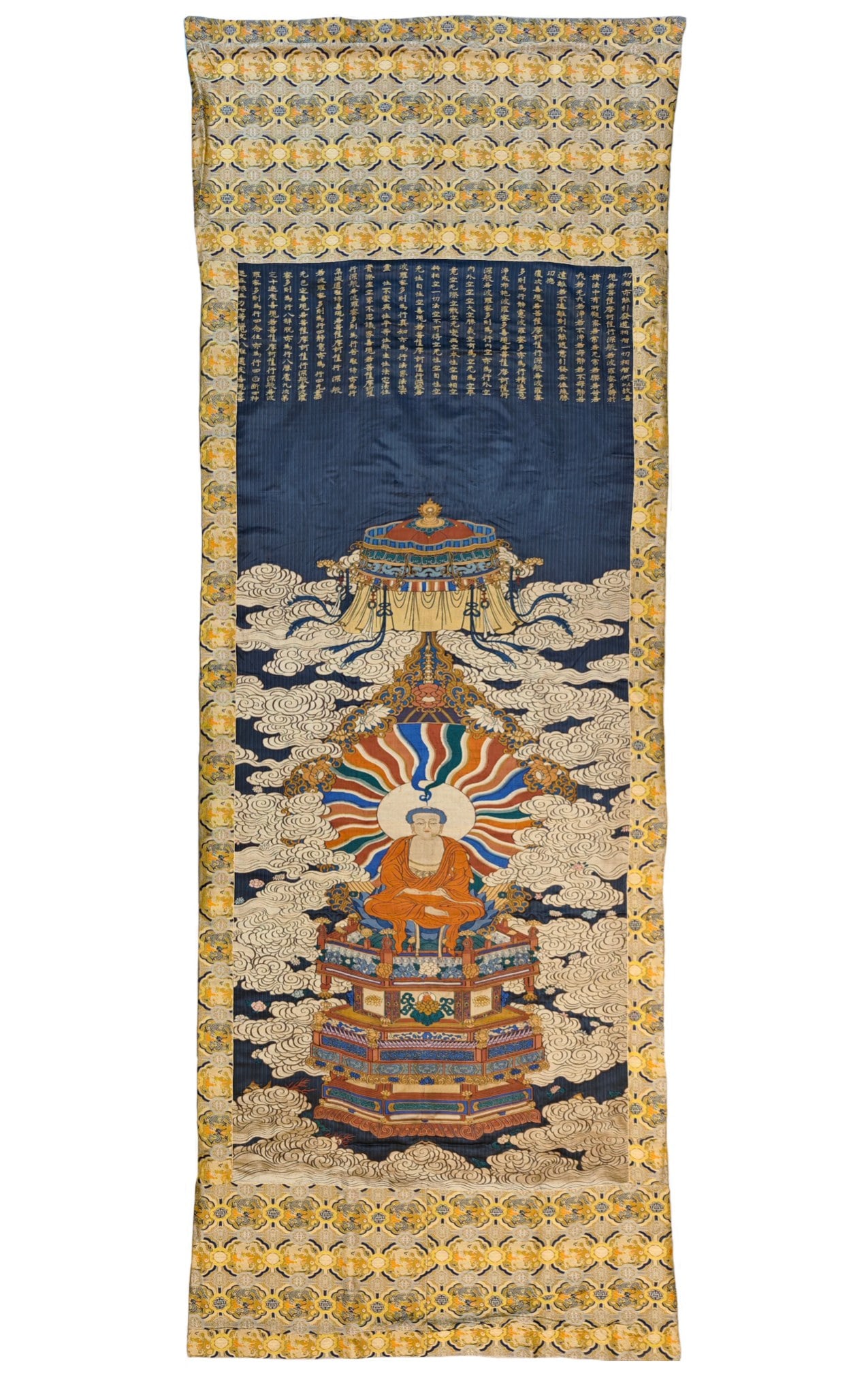 A beautifully woven thangka with images of Sakyamuni: An exquisite brocade image of Sakyamuni thangka, with poetry, Qing Dynasty, China, making an exquisite brocade work required multiple complex processes, including design, weaving, sizing, cutting, etc