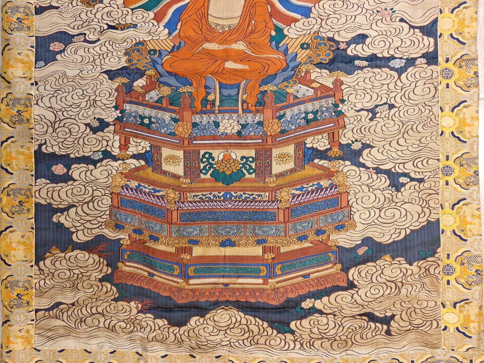 A beautifully woven thangka with images of Sakyamuni - 9