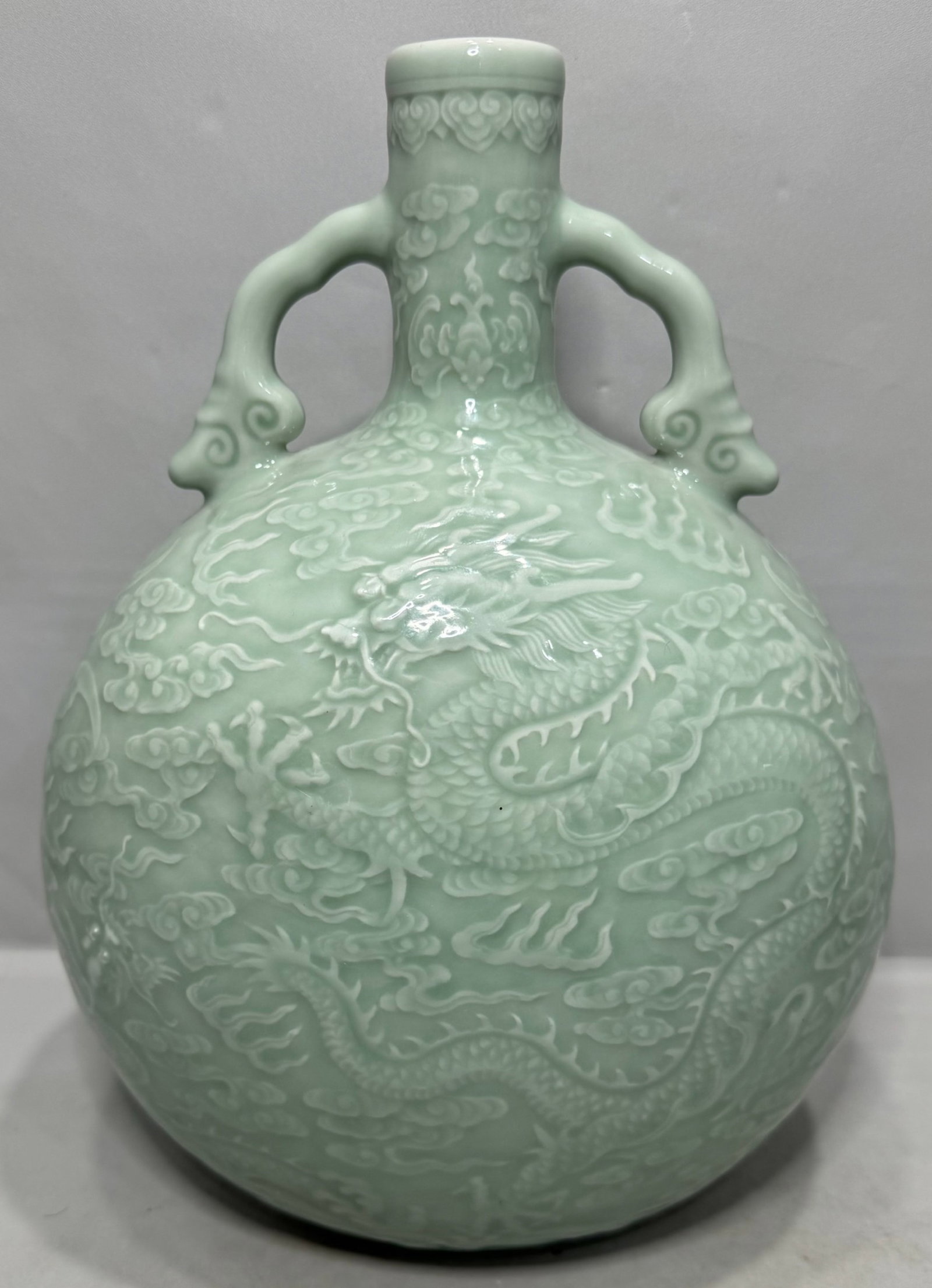 A Rare Celadon Glazed Auspicious Cloud and Dragon Pattern Double-Ears Vase (1 of 6)