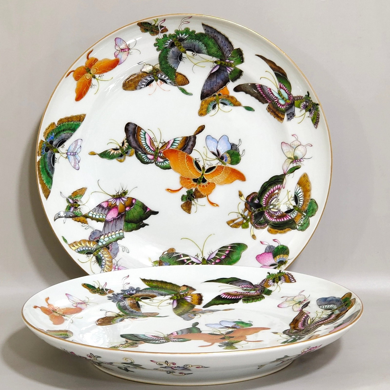 A Pair of Exquisite Famille-Rose Butterfly Pattern Plates: A Pair of Exquisite Famille-Rose Butterfly Pattern Plates,Qing Dynasty,China,Jiaqing Six-character Mark,Size:1.5inx9.5in
