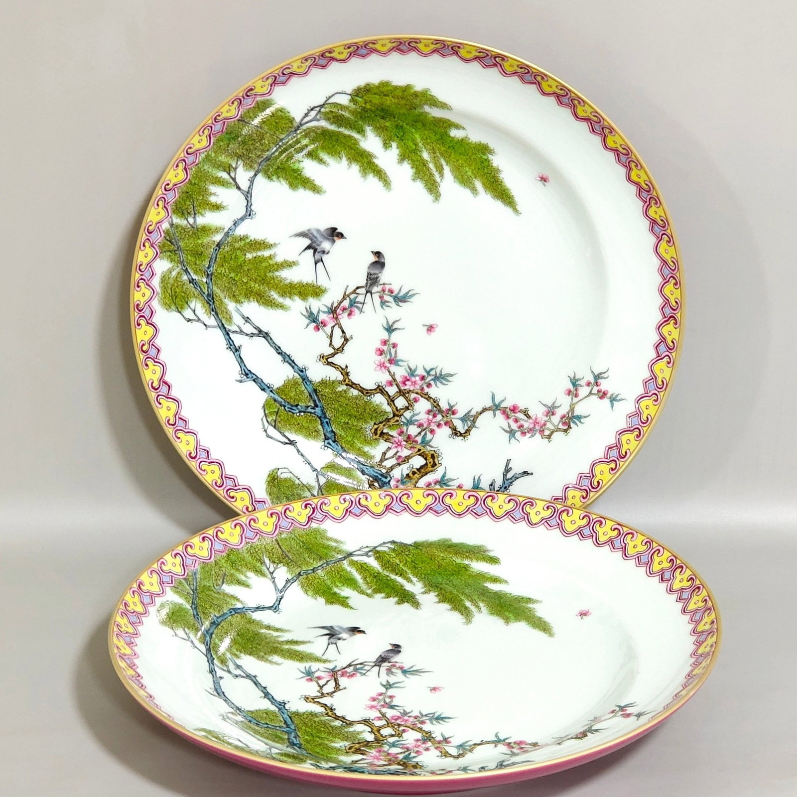 A Pair of Exquisite Ruby Red-Glazed Famille-Rose Flower and Bird Pattern Plates: A Pair of Exquisite Ruby Red-Glazed Famille-Rose Flower and Bird Pattern Plates,Qing Dynasty,China,Yongzheng Six-character Mark,Size:1.6inx9.4in