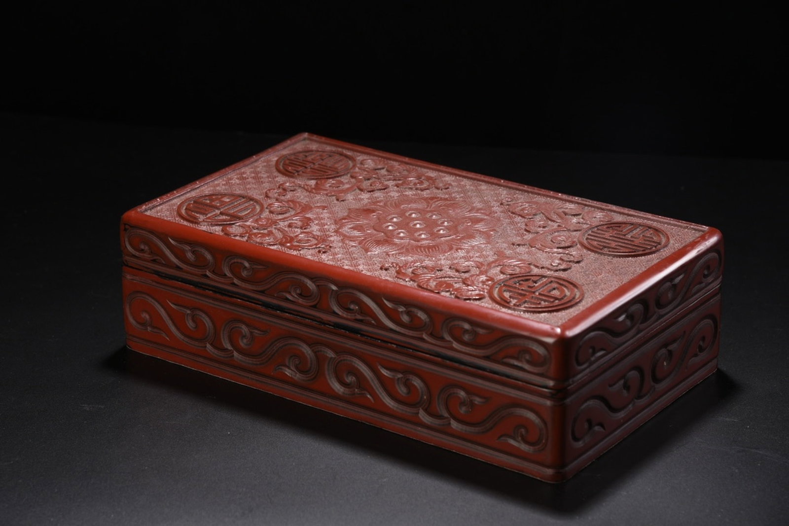 An Exquisite Carved Red Lacquer Bats and Peach Pattern Box: An Exquisite Carved Red Lacquer Bats and Peach Pattern Box,Qing Dynasty,China,Size:3.1inx11.4inx6.7in,Weight:1115g 剔红漆福寿纹盒,中国清