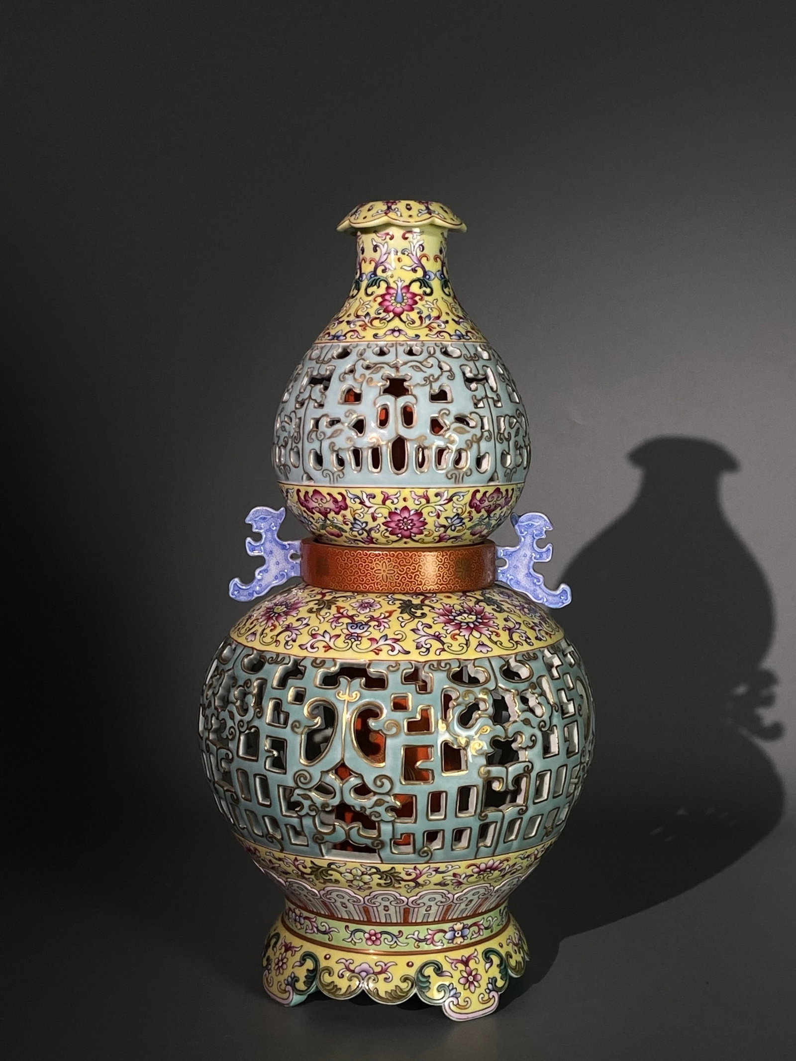 A Rare Enamel Celadon Glazed Hollow Painted Gold Double-Ears Gourd-Shaped Vase: A Rare Enamel Celadon Glazed Hollow Painted Gold Double-Ears Gourd-Shaped Vase,Qing Dynasty,China,Qianlong Six-character Mark,Size:13.8inx7.1in 珐琅彩青釉镂空