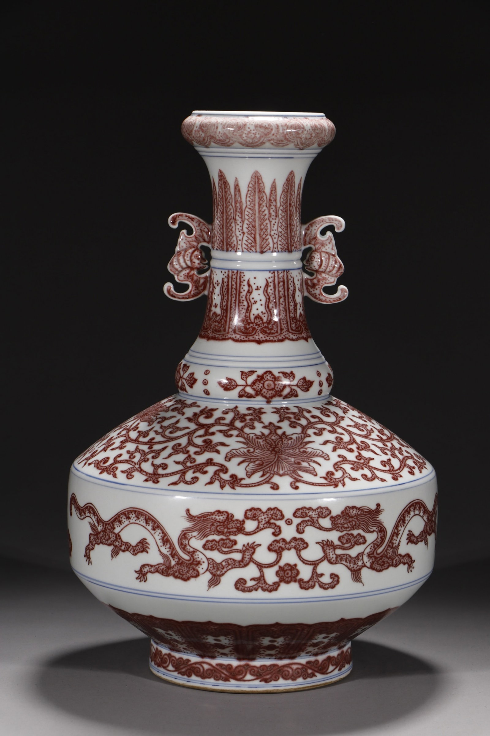 A Rare Underglaze-Red Lotus and Dragon Pattern Double-Ears Vase: A Rare Underglaze-Red Lotus and Dragon Pattern Double-Ears Vase,Qing Dynasty,China,Qianlong Six-character Mark,Size:12.4in