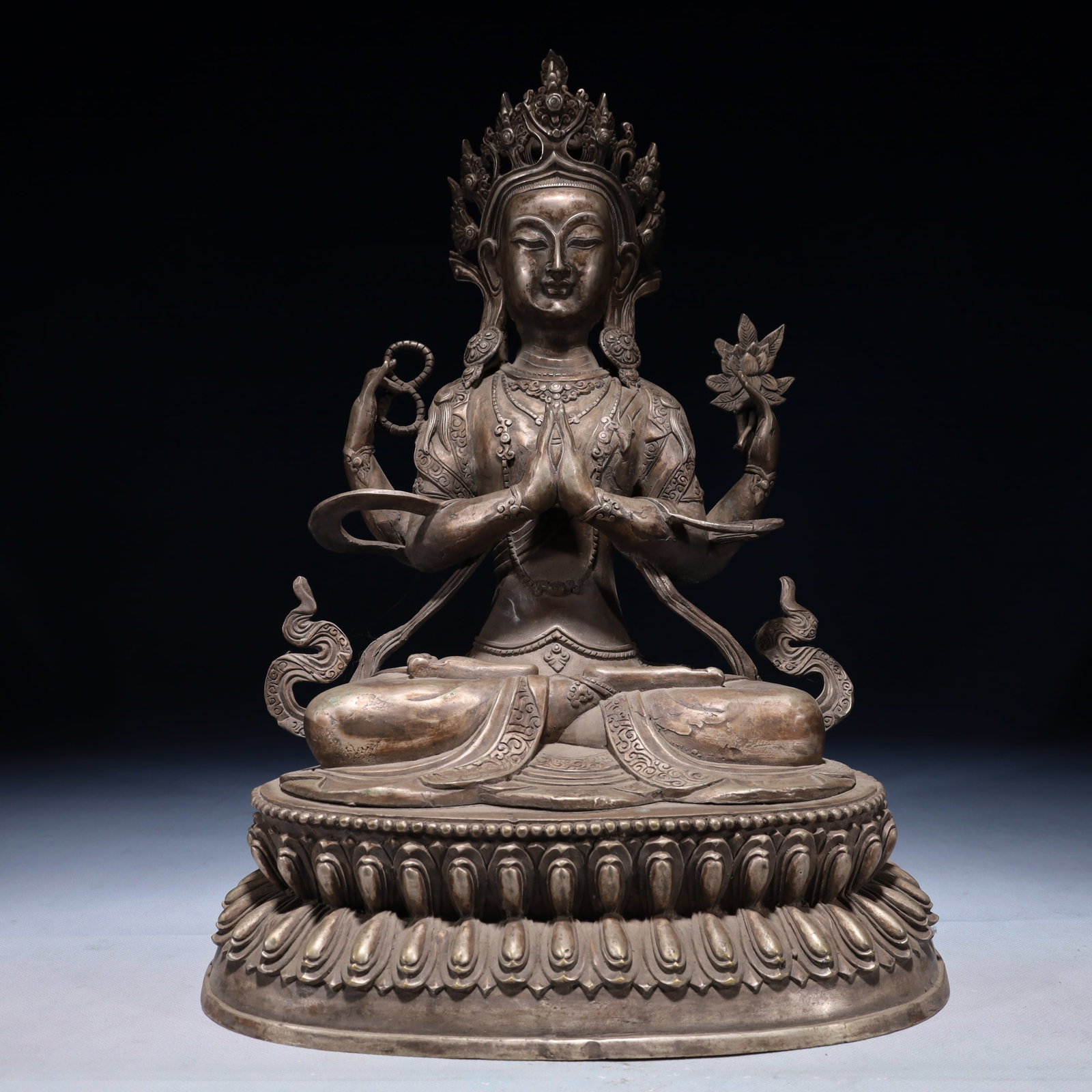 A Solemn Silver-plated Bronze Statue of Four-Arms Avalokitesvara: A Solemn Silver-plated Bronze Statue of Four-Arms Avalokitesvara,Qing Dynasty,China,Size:12.2inx9.4inx17.7in,Weight:5700g