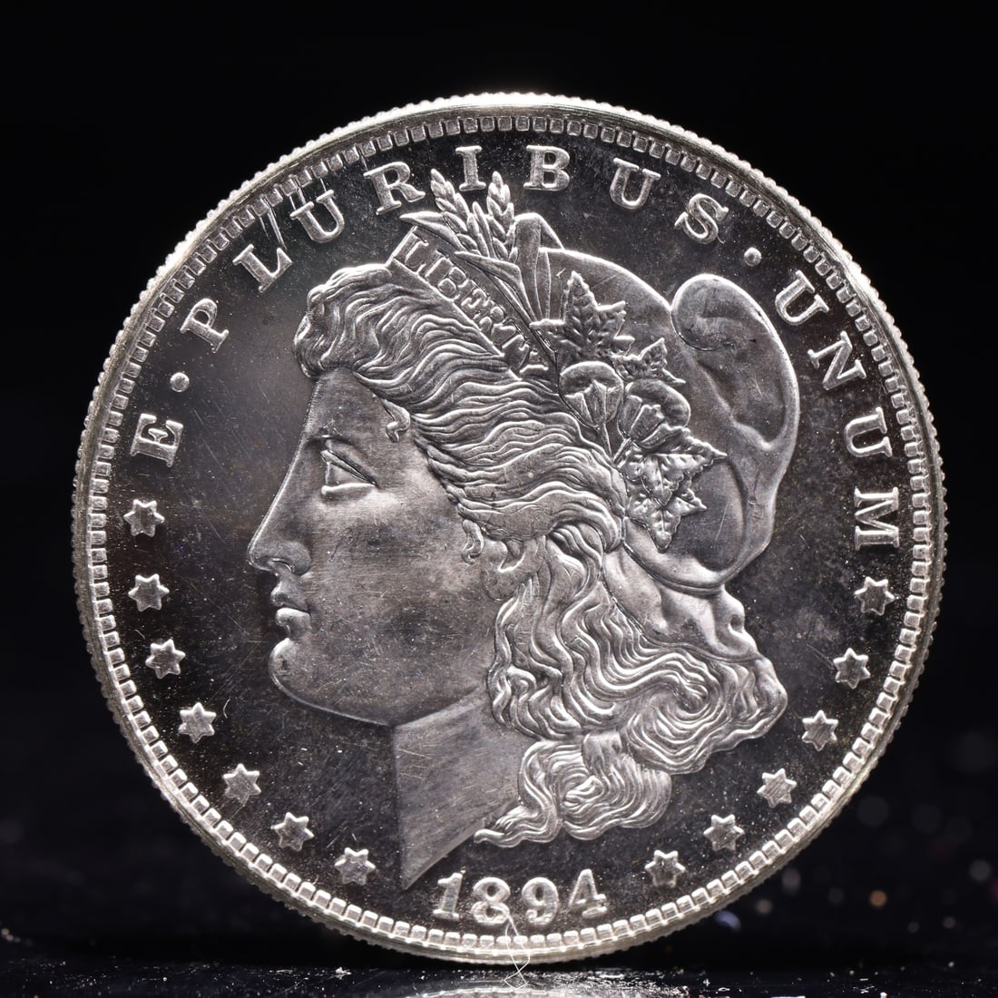 USA Morgan Dollar 1894 Coin: Obv: profile bust with date below and E PLURIBUS UNUM legend and stars around. Rev: eagle with In God we trust above within wreath with UNITED STATES OF AMERICA ONE DOLLAR legend. IN GOD WE TRUST / LI