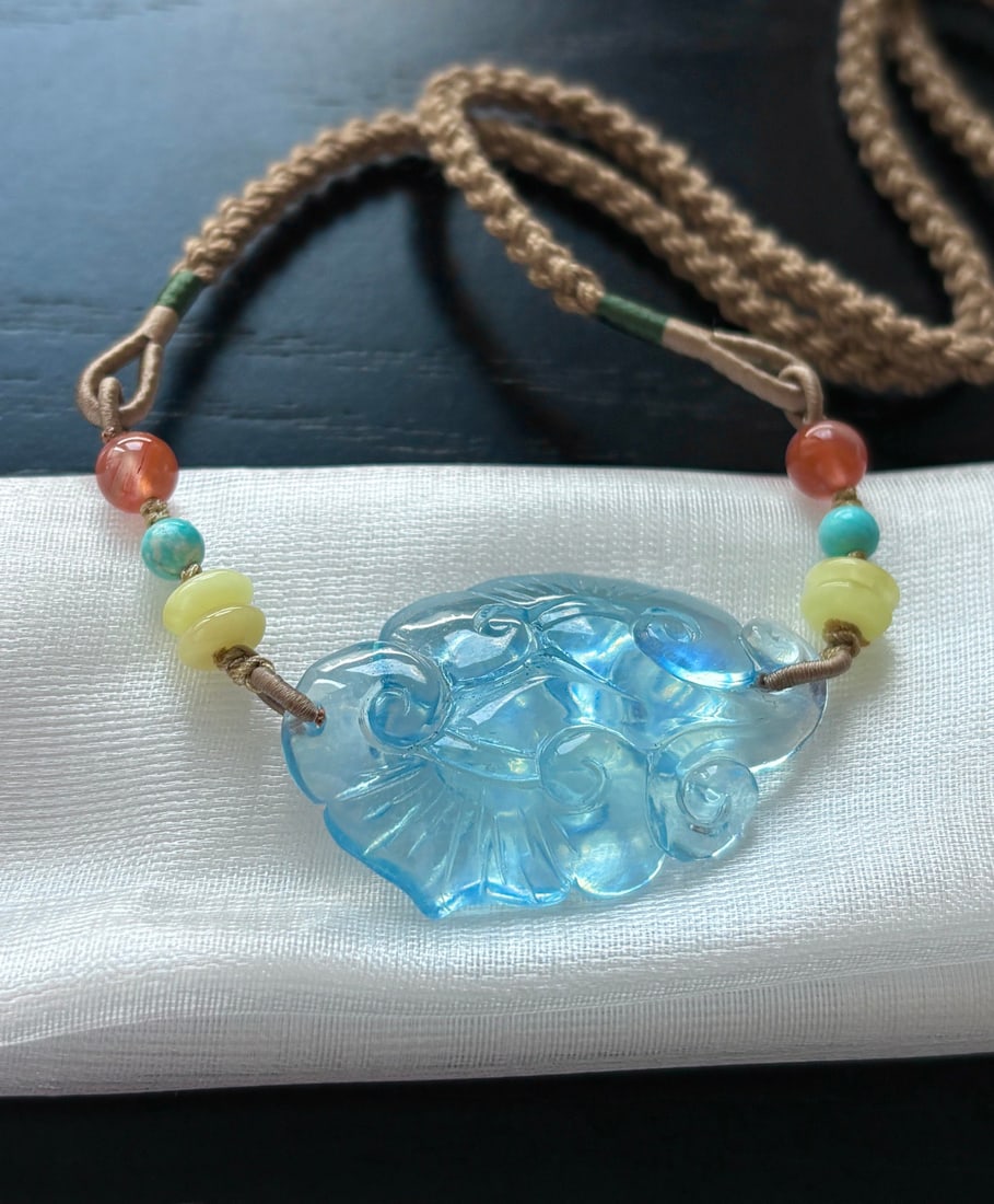 An Exquisite Aquamarine Ruyi Necklace: An Exquisite Aquamarine Ruyi Necklace,Size:1.5inx0.9inx0.3in,Weight:10.9g 海蓝宝如意吊坠
