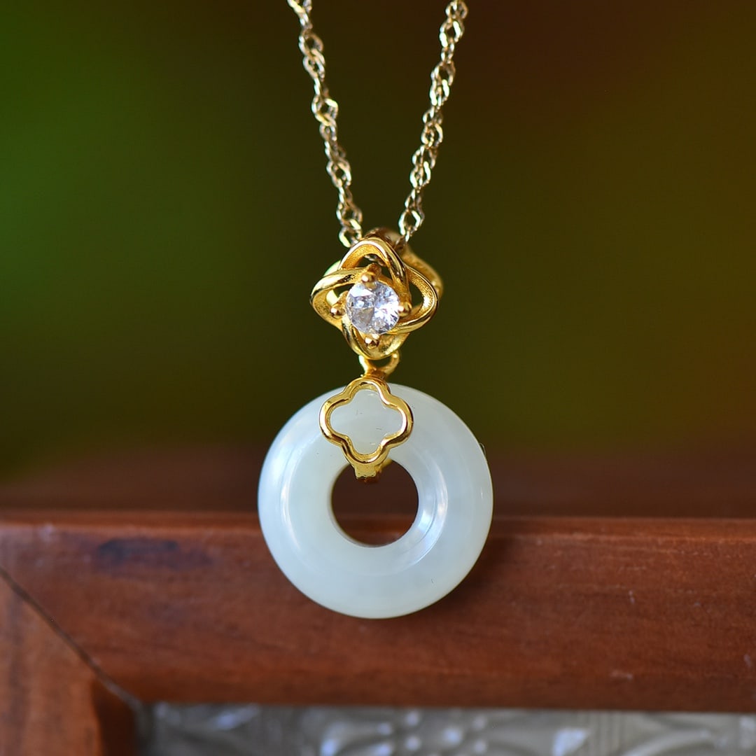 An Exquisite Sterling Silver-Gold Plated Inlaid White Jade Pendant: An Exquisite Sterling Silver-Gold Plated Inlaid White Jade Pendant,Size:0.6inx0.6in 纯银镀金镶白玉吊坠
