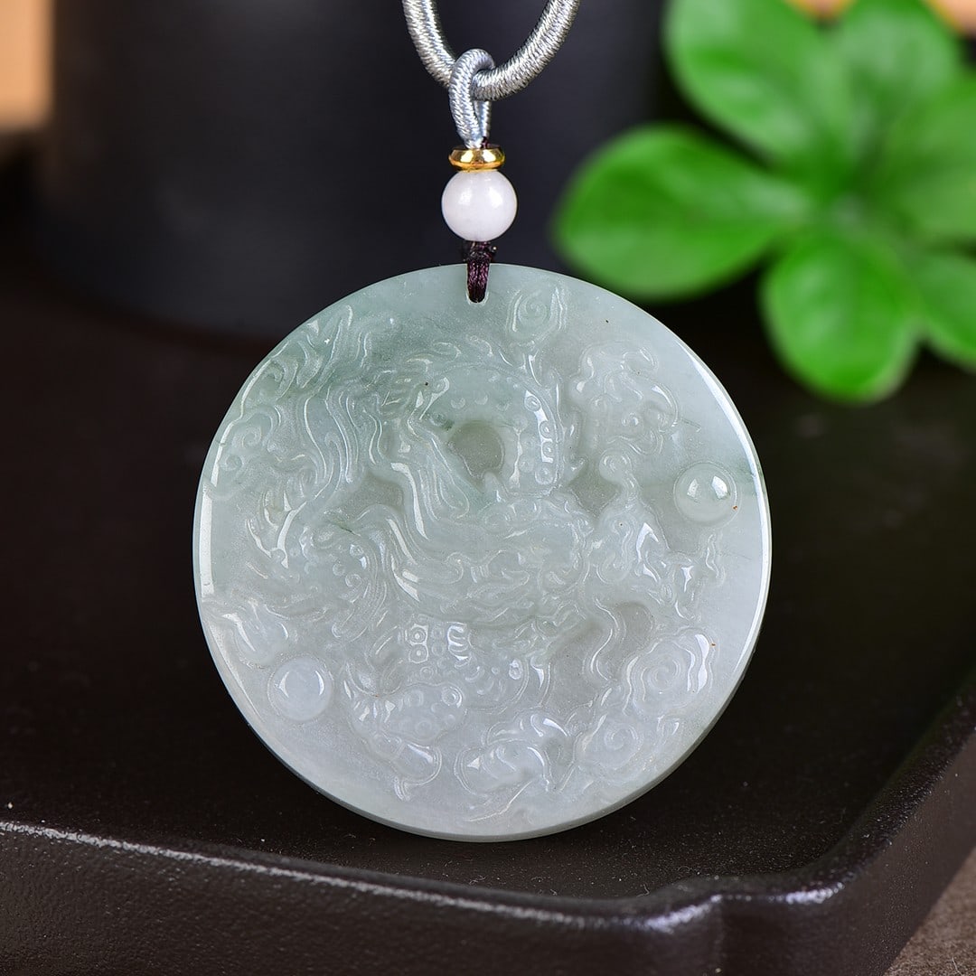A Pair of Exquisite Jadeite Dragon and Phoenix Pattern Pendants (1 of 2)