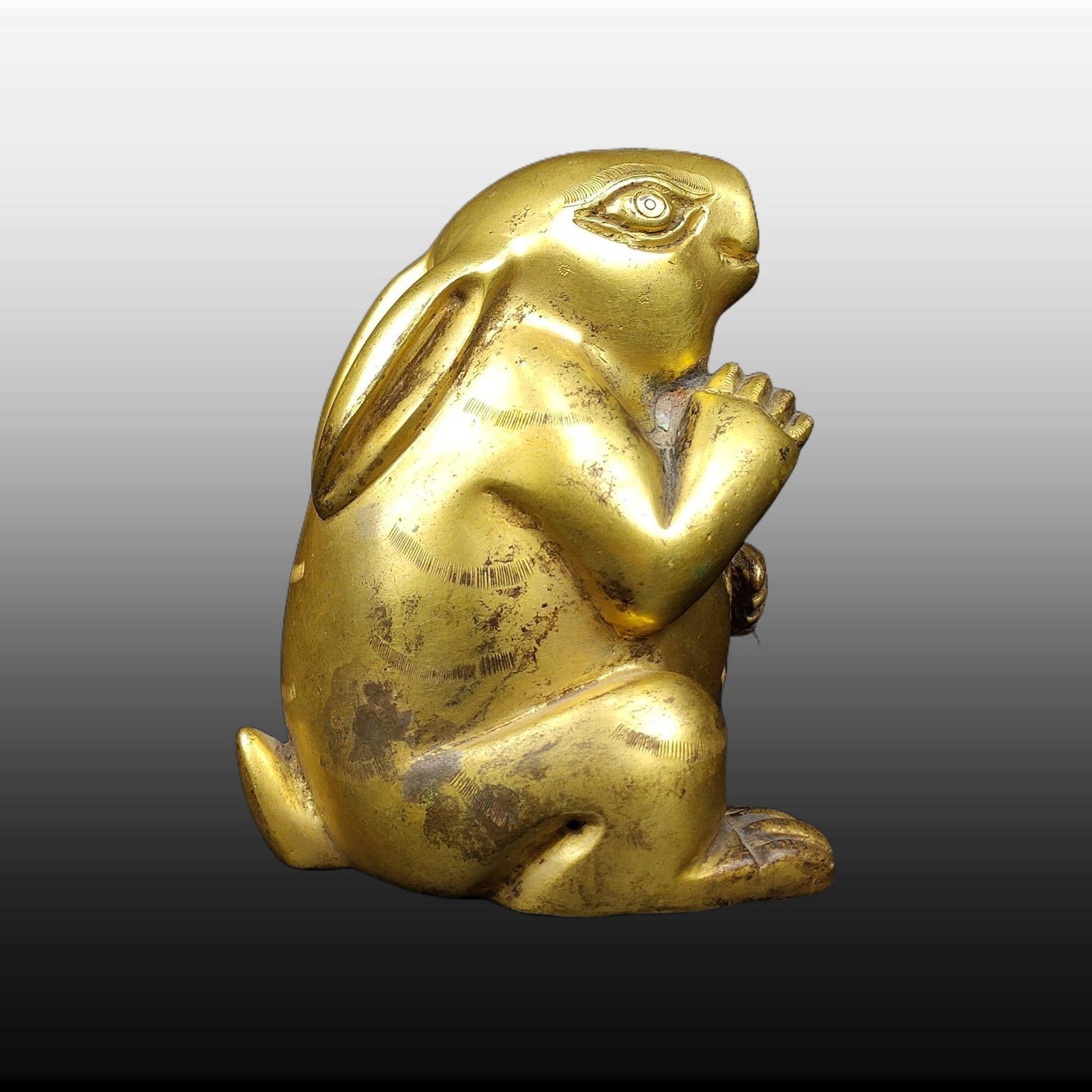 A Exquisite Gilt Bronze Rabbit Paper Weight: A Exquisite Gilt Bronze Rabbit Paper Weight,Ming Dynasty, China,Size:3.5inx2.8in,Weight:421g 铜鎏金兔镇纸,中国明代