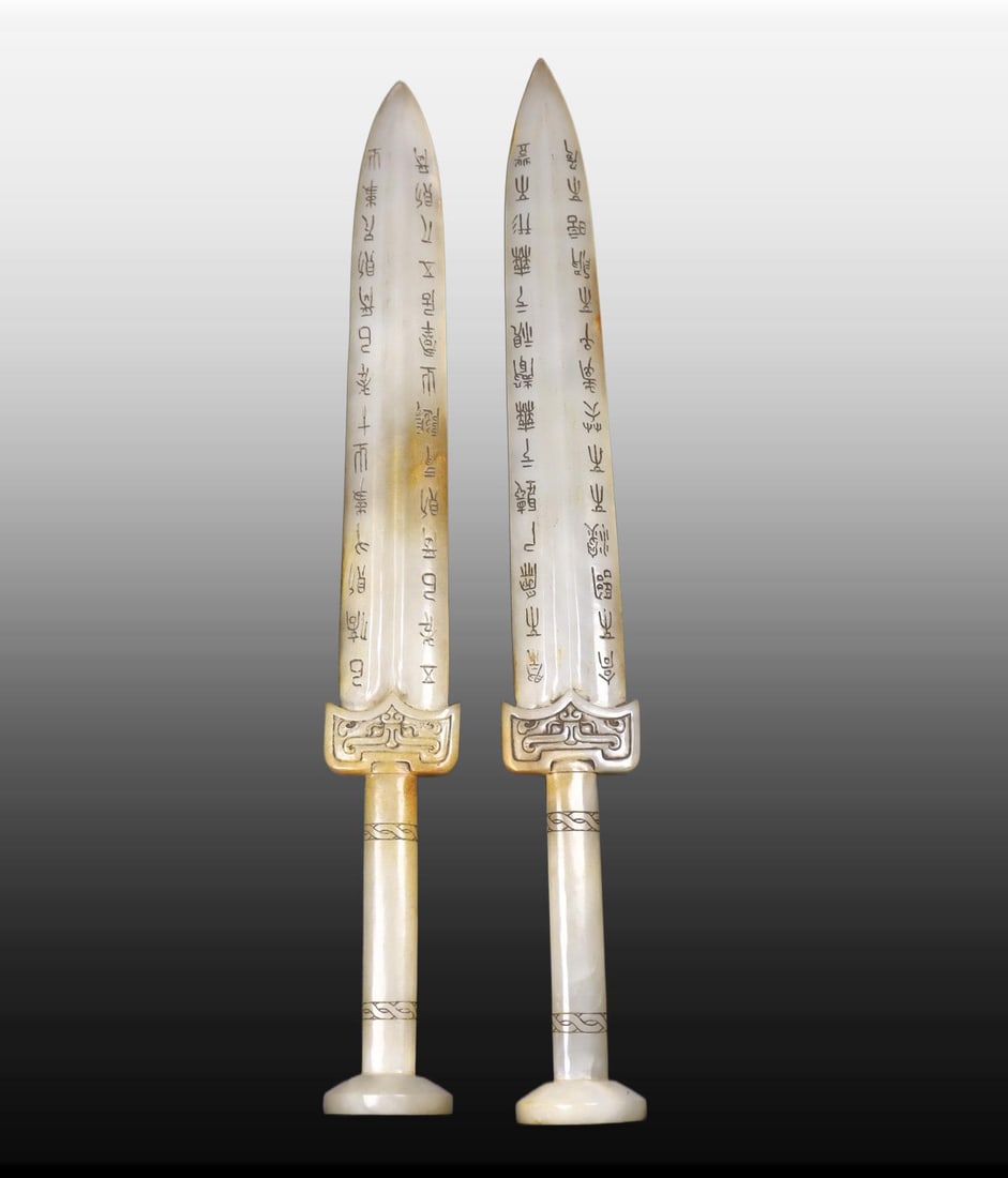 A pair of Exquisite Hotan Jade Sword: A pair of Exquisite Hotan Jade Sword,Han Dynasty, China,Size:15.2inx2.2inx1.6in,Weight:280g 一对和田玉剑,中国汉代