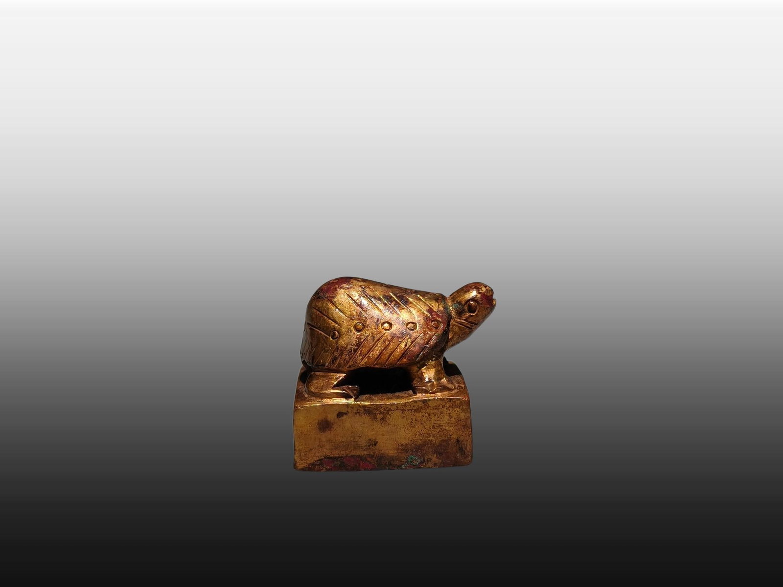 A Exquisite Gilt Bronze Turtle Seal: A Exquisite Gilt Bronze Turtle Seal,Han Dynasty, China,Size:1inx1.1inx0.9in,Weight:g 铜鎏金龟印章,中国汉代