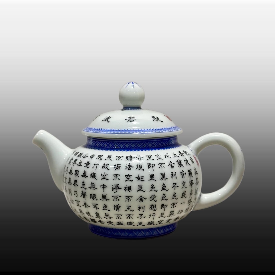 A Exquisite Guan yao Blue and White Scripture Teapot: A Exquisite Guan yao Blue and White Scripture Teapot,Qing Dynasty, China,Yongzheng Four-character Mark,Size:4.3inx2.6inx6.3inx2.6in 官窑青花经文壶,中