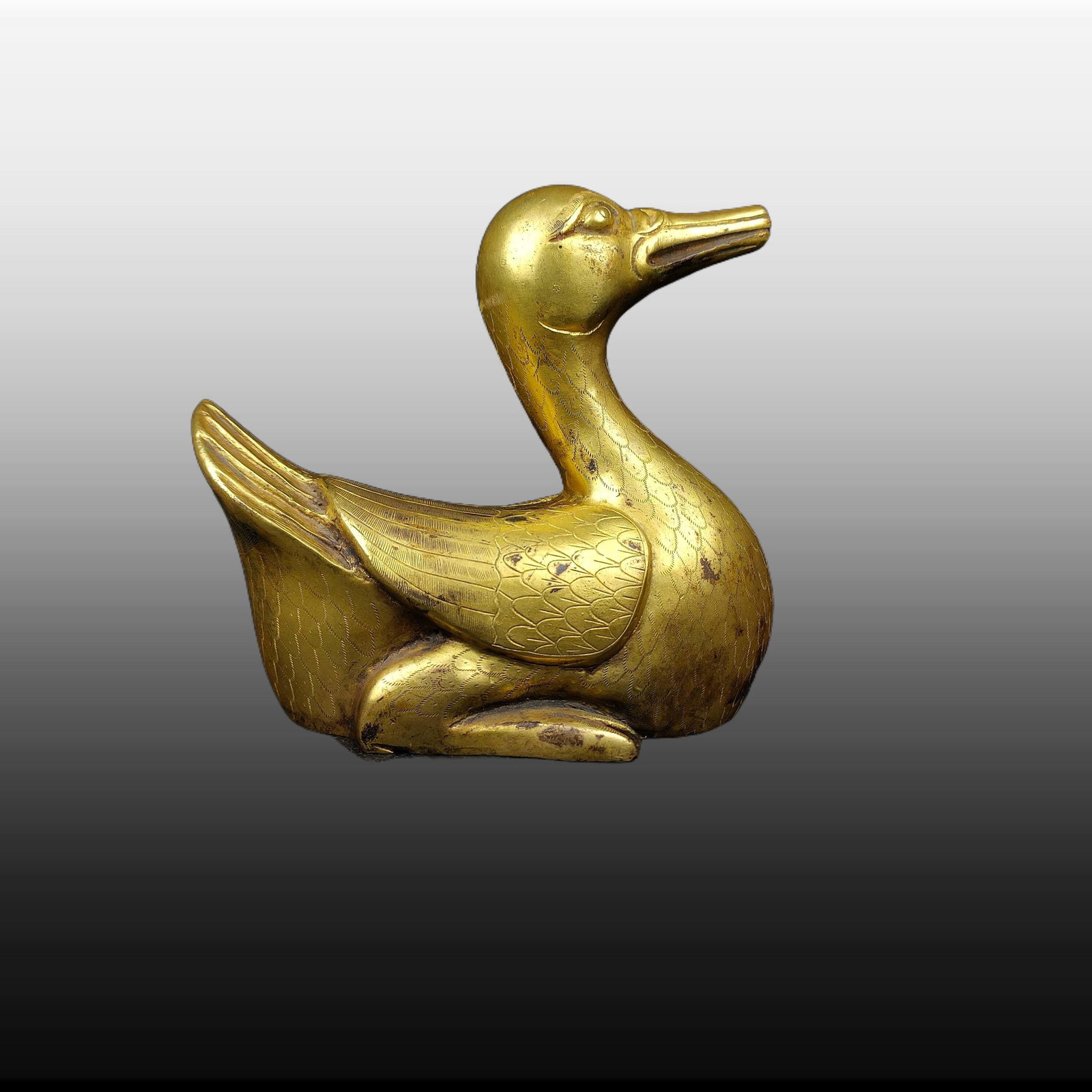 A Exquisite Gilt Bronze Duck-shaped Ornament: A Exquisite Gilt Bronze Duck-shaped Ornament,Ming Dynasty, China,Size:4.7inx4.3in,Weight:530g 铜鎏金鸭形摆件,中国明代