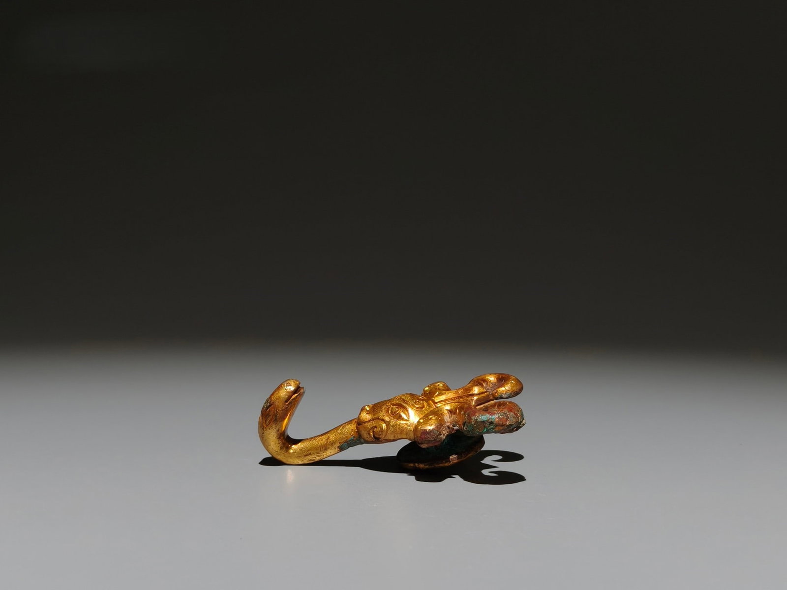 A Exquisite Gilt Bronze Buffalo Head Handheld Carving: A Exquisite Gilt Bronze Buffalo Head Handheld Carving,Han Dynasty, China,Size:2.5inx1.5in,Weight:g 铜鎏金牛头手把件,中国汉代