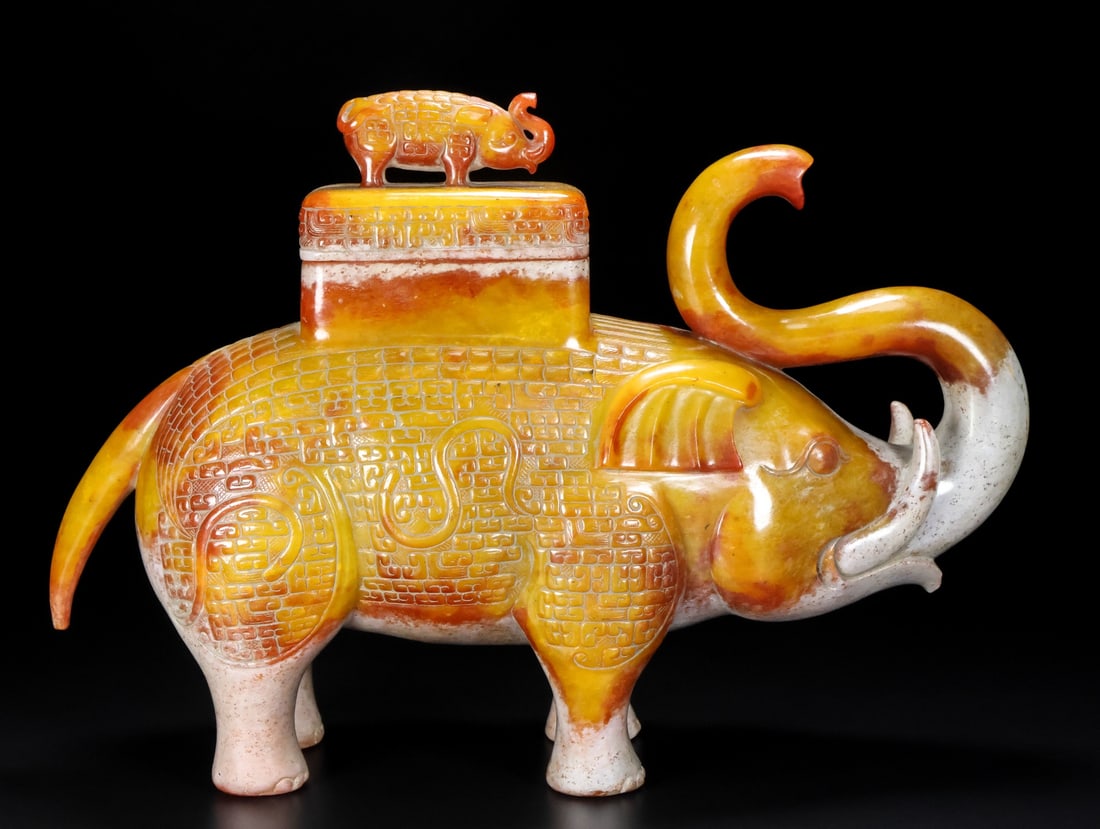 A Exquisite Hotan Jade Elephant Ornament: A Exquisite Hotan Jade Elephant Ornament,Han Dynasty, China,Size:11.6inx3.5inx7.9in,Weight:3509g 和田玉象摆件,中国汉代