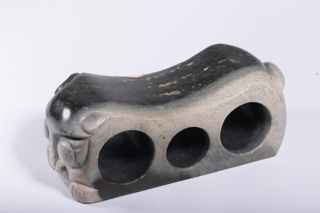 A Exquisite Gaogu Jade Animal Head Pillow: A Exquisite Gaogu Jade Animal Head Pillow,Ancient Time, China,Size:9.4inx3.5inx3.5in ,Weight:2973g 高古玉兽首玉枕,远古时期