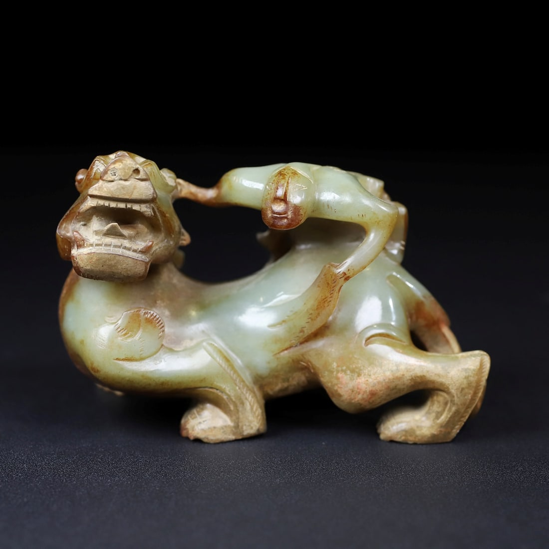 A Exquisite Hotan Jade Auspicious Beast Ornament: A Exquisite Hotan Jade Auspicious Beast Ornament,Han Dynasty, China,Size:3.9inx2.2inx2.6in,Weight:333.9g 和田玉瑞兽摆件,中国汉代