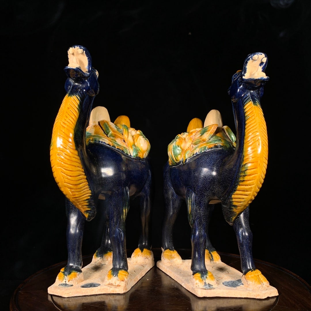 A pair of Exquisite Tang Tri-Color Glazed Pottery Camel: A pair of Exquisite Tang Tri-Color Glazed Pottery Camel,Tang Dynasty, China,Size:10.6inx7.7in 一对唐三彩骆驼,中国唐代