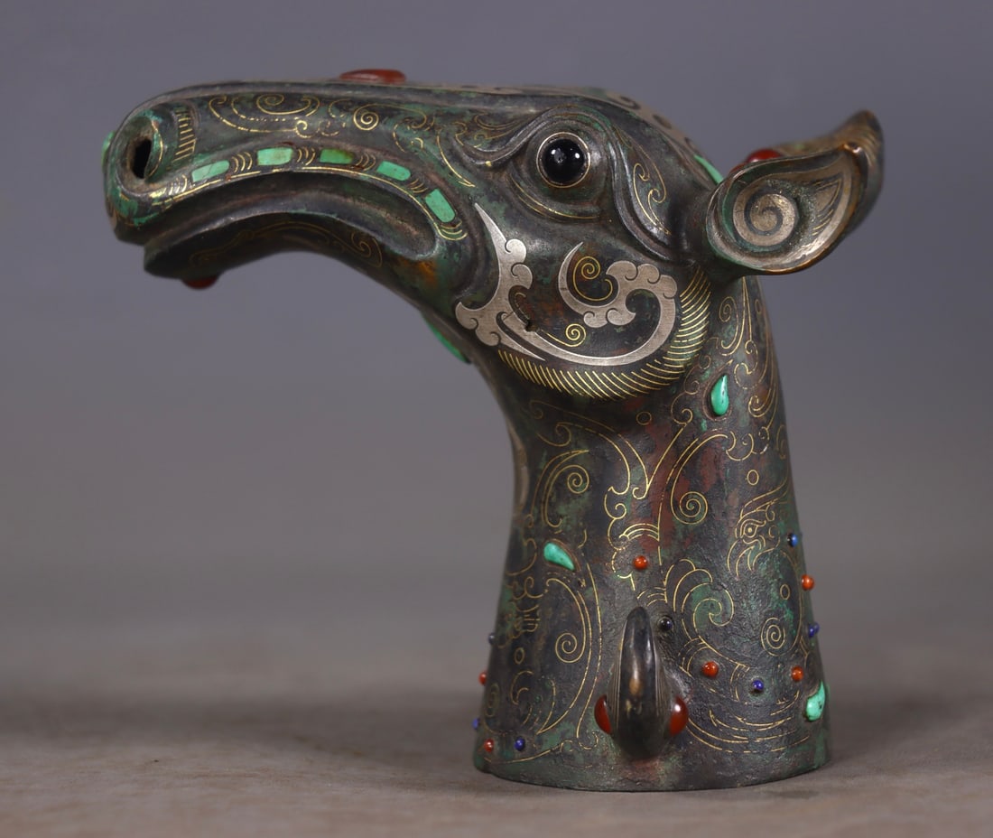 A Exquisite Gold and Silver-Inlaid Bronze Inlaid Gems Horse Head Ornament: A Exquisite Gold and Silver-Inlaid Bronze Inlaid Gems Horse Head Ornament,Han Dynasty, China,Size:3.9inx4.3inx3in,Weight:370g 青铜错金银镶嵌宝石&#