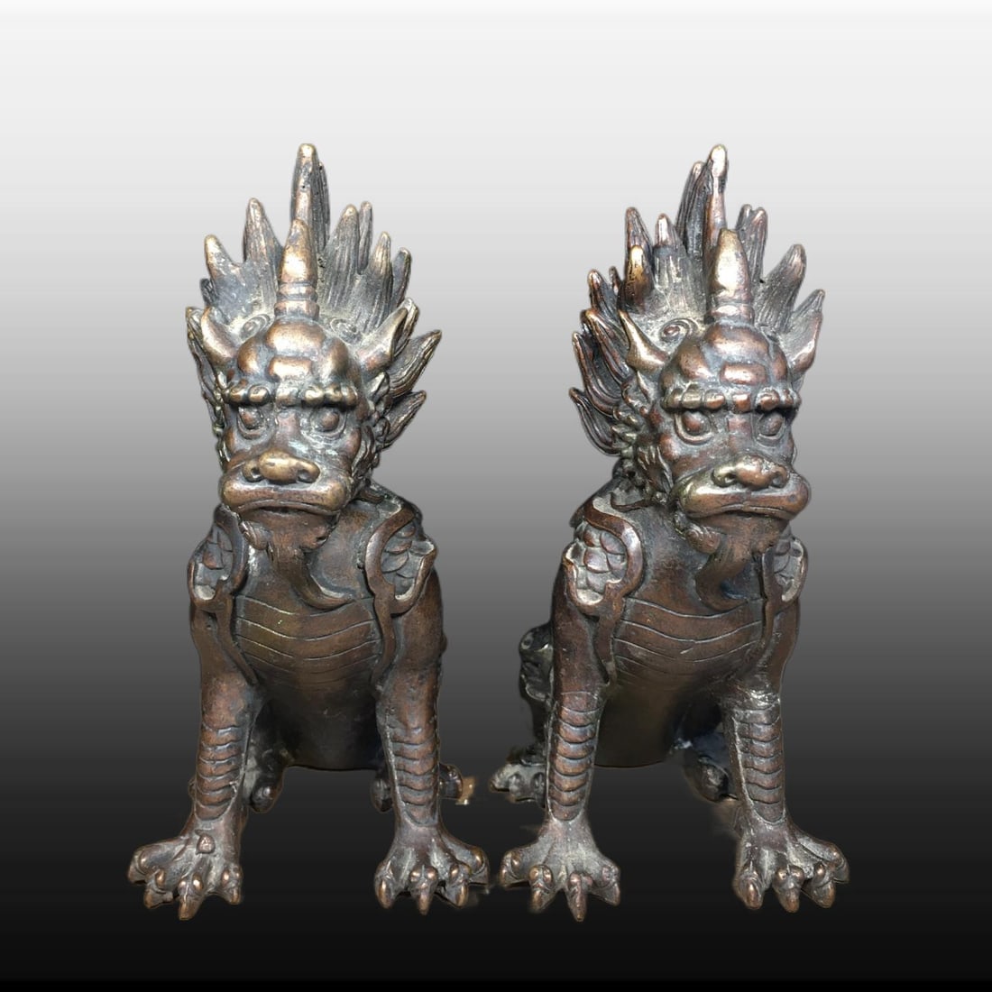 A pair of Exquisite Copper Auspicious Beast Ornaments: A pair of Exquisite Copper Auspicious Beast Ornaments,Northern Wei Dynasty,Size:5.5inx2.8in,Weight:1670g 一对铜瑞兽摆件,北魏