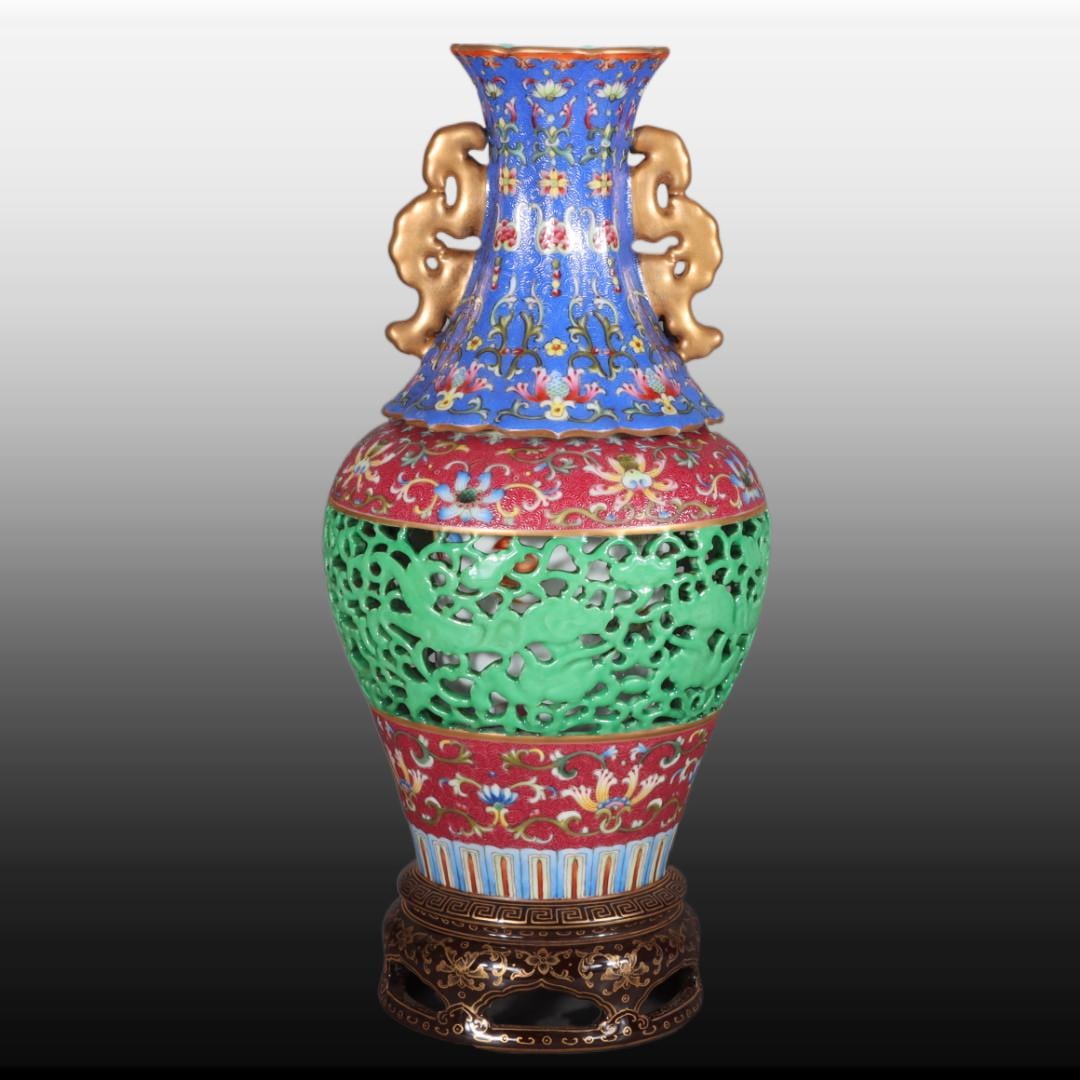 A Exquisite Doucai Painted Gold Hollow Double-Ears Vase: A Exquisite Doucai Painted Gold Hollow Double-Ears Vase,Qing Dynasty, China,Qianlong Four-character Mark,Size:11.6inx2.6inx3.9in 斗彩描金镂空双耳瓶