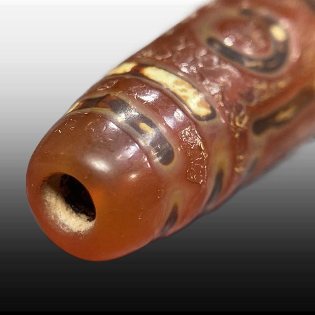 A Exquisite Ruby Six Eyes Dzi bead - 3