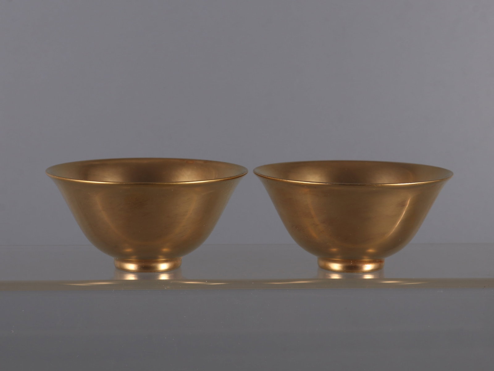 A pair of Exquisite Gilt Bronze Cup: A pair of Exquisite Gilt Bronze Cup,Qing Dynasty, China,Yongzheng Six-character Mark,Size:1.7inx3.3in