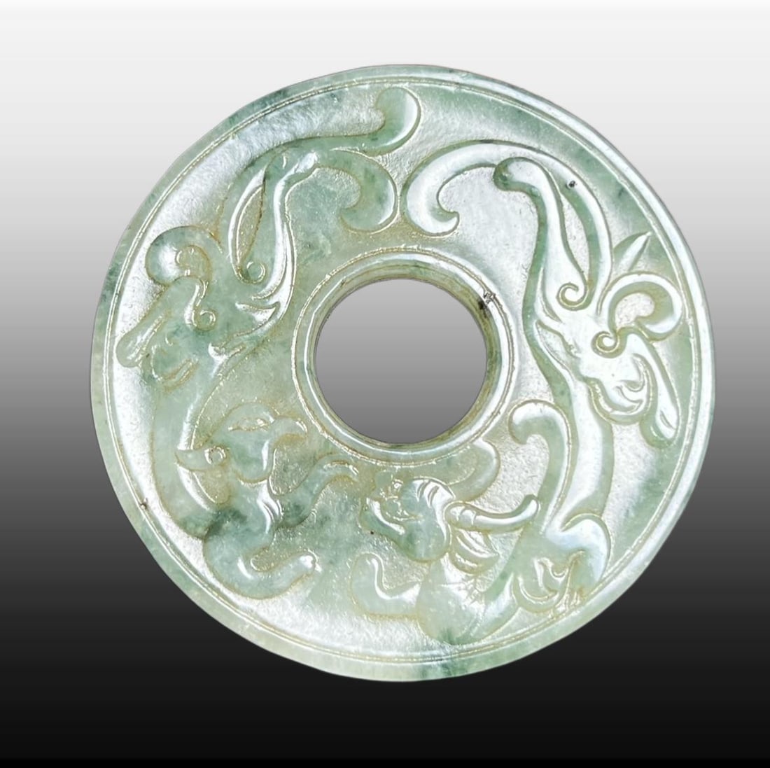 A Exquisite Jadeite Dragon and Phoenix Pattern Jade Bi: A Exquisite Jadeite Dragon and Phoenix Pattern Jade Bi,Qing Dynasty, China,Size:2inx0.2in,Weight:29g 翡翠龙凤纹玉壁,中国清代